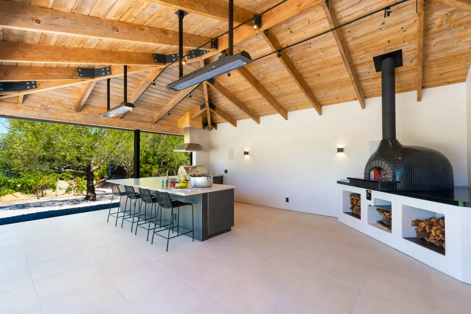 Custom outdoor kitchen and pizza oven built into the landscape in Healdsburg, CA