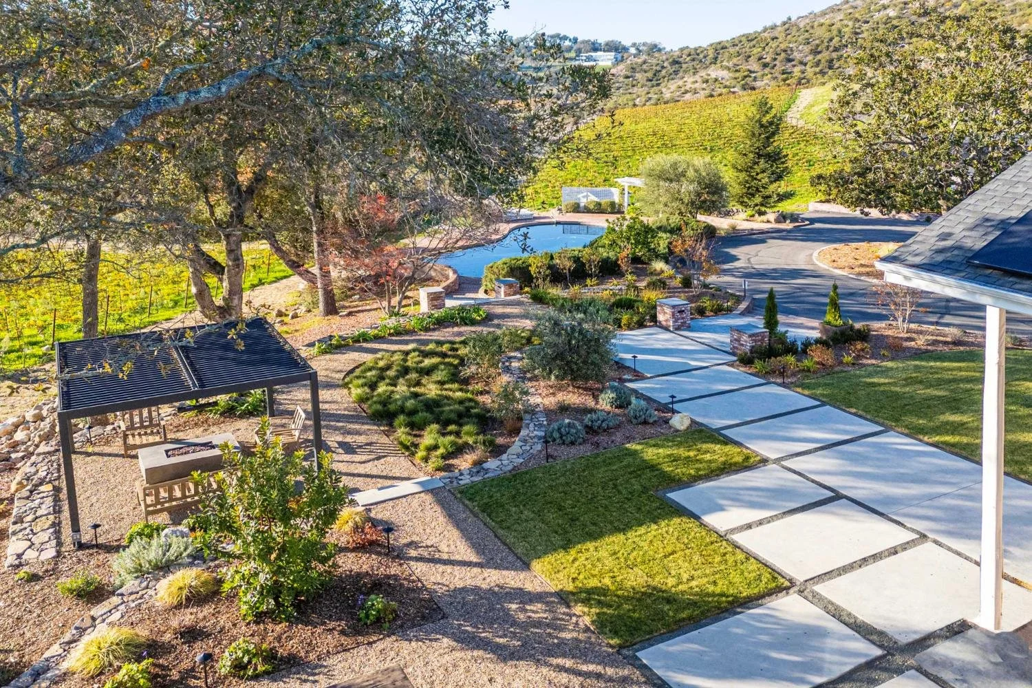 Outdoor living zones connected by clean concrete walkways in Napa, CA