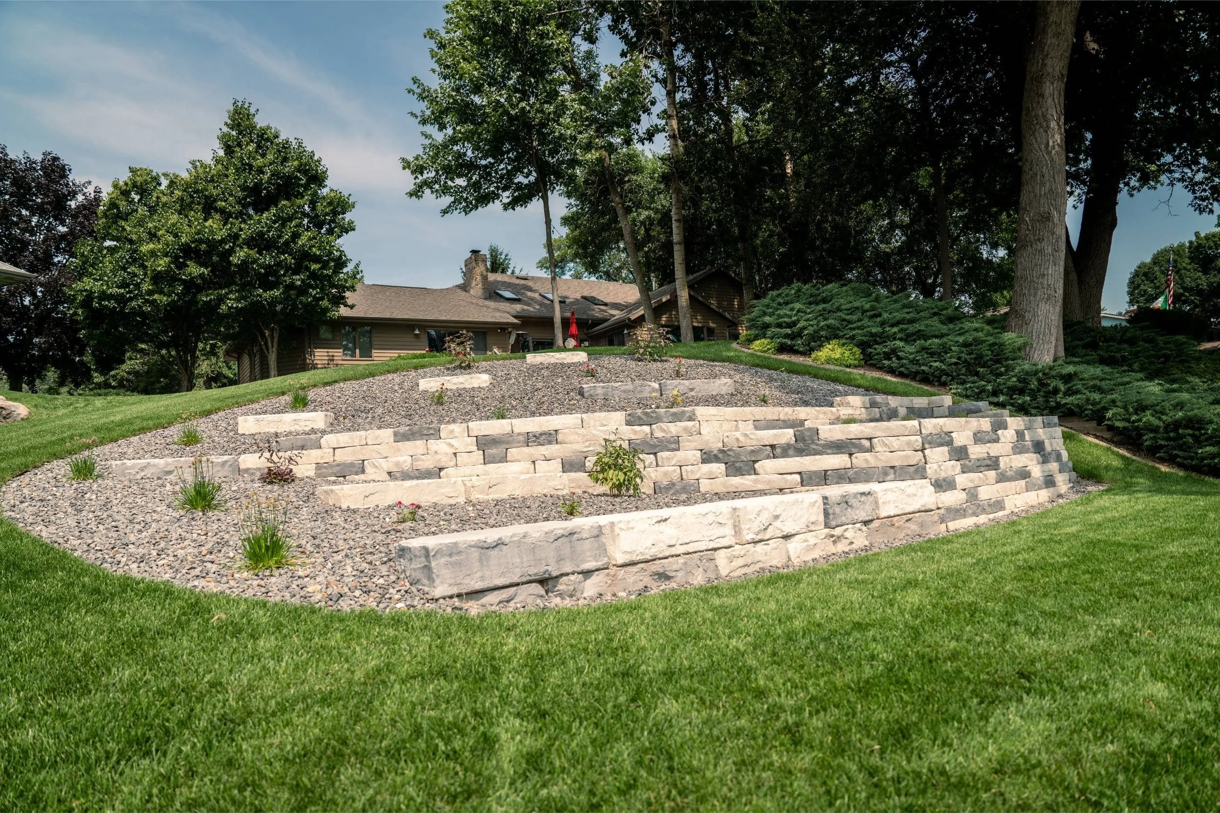 A custom lakeside retaining wall enhanced with outdoor lighting in Green Bay, WI
