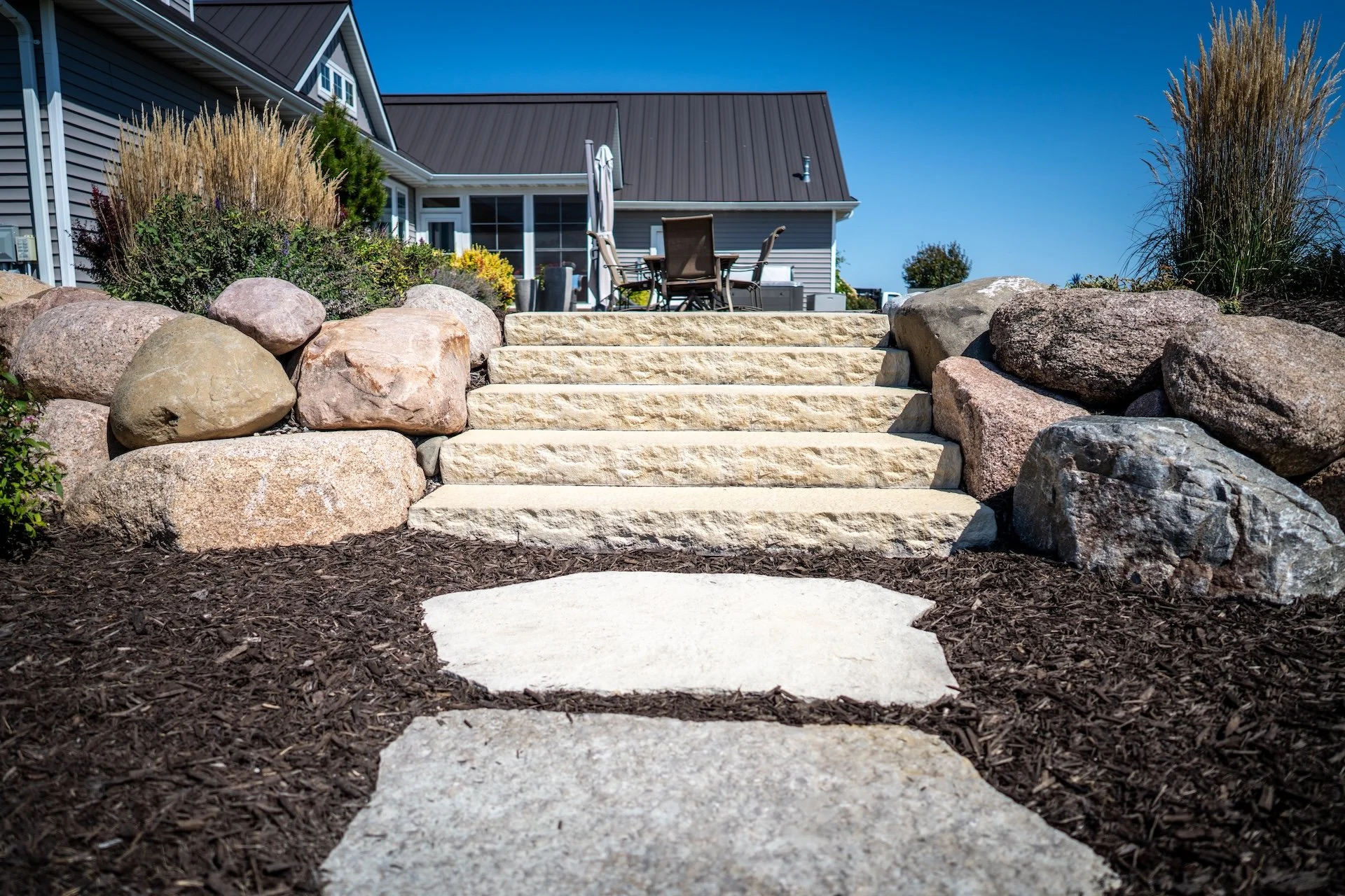 5 Ways Mulch in Harrison and Neenah, WI, Helps Your Landscape Look More Finished