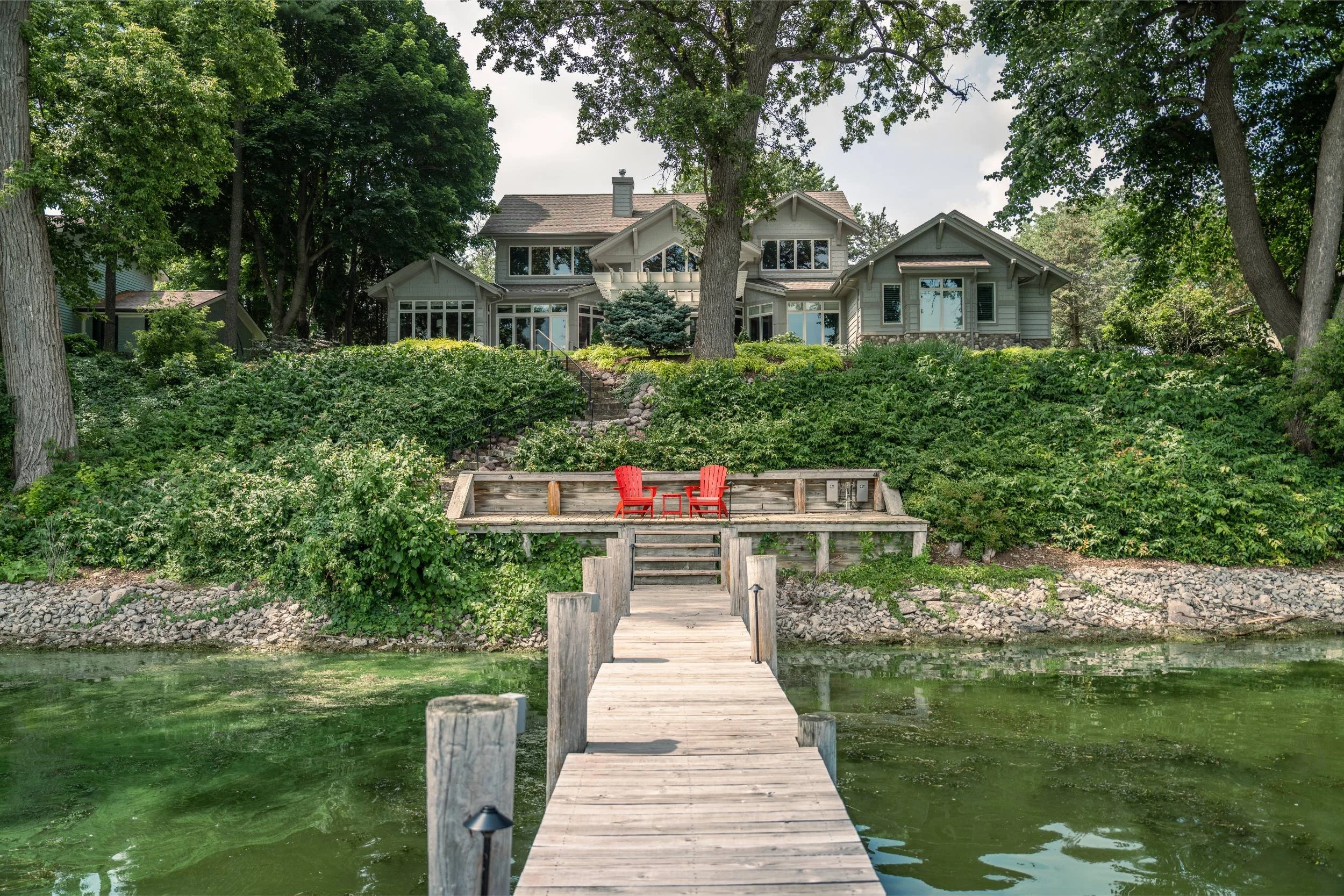 A paver patio and gas fire pit overlooking the Fox River in Green Bay, WI