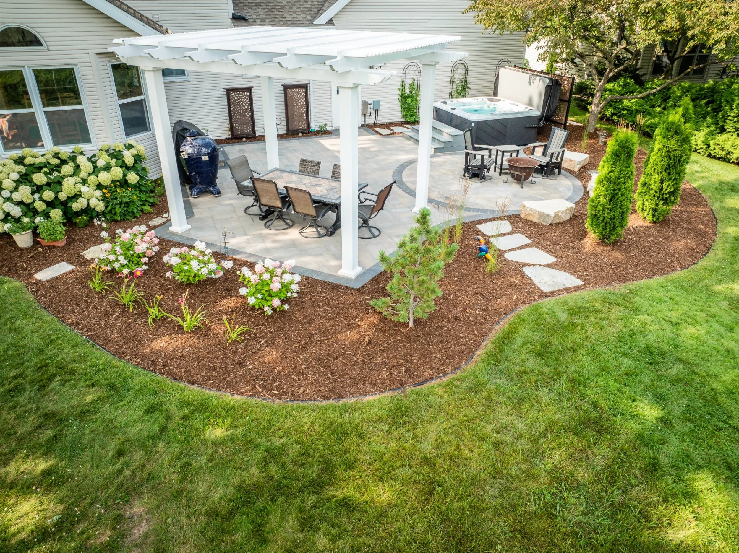 A custom outdoor space for entertaining with landscaping near me in Greenville, WI