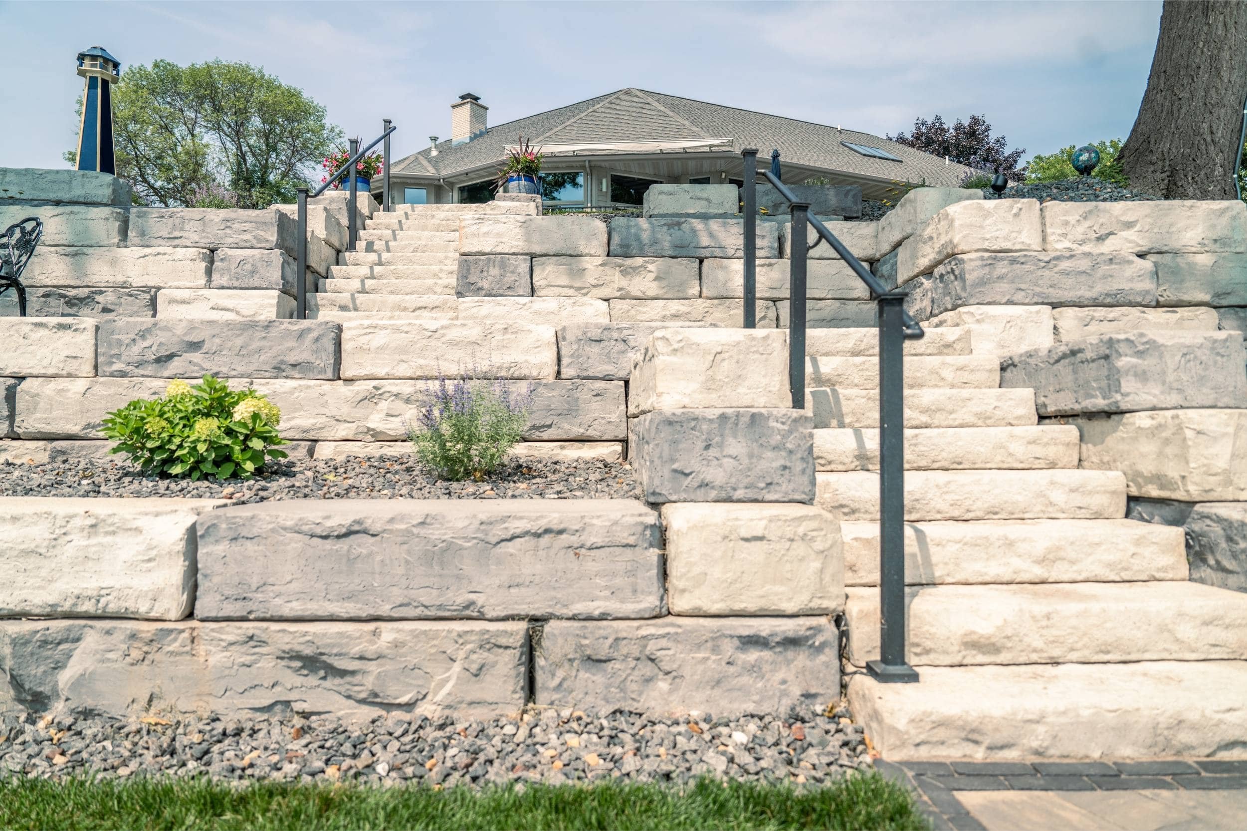 A peaceful fire pit area built along the shoreline in Oshkosh, WI