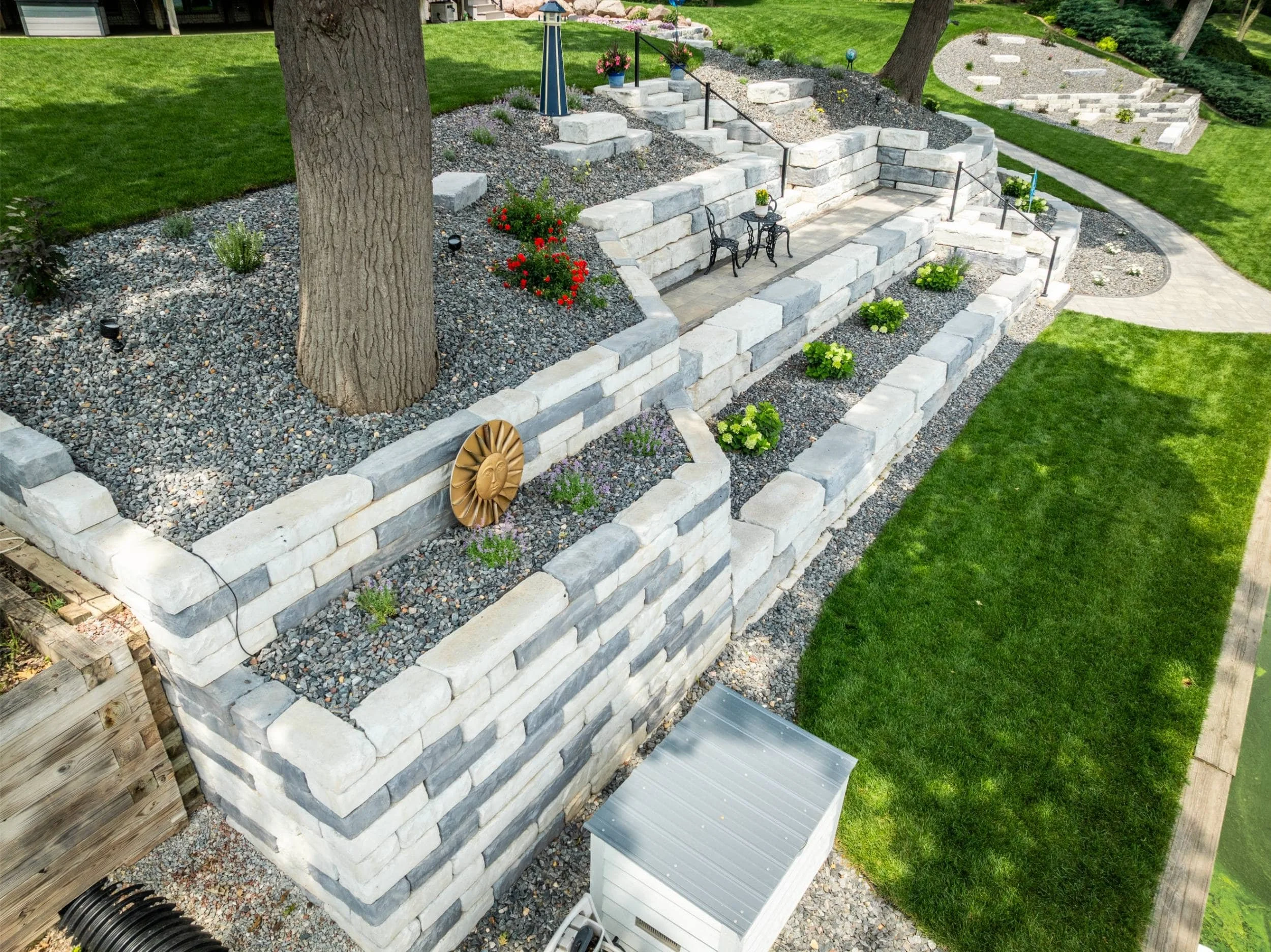 A peaceful fire pit area built along the shoreline in Oshkosh, WI