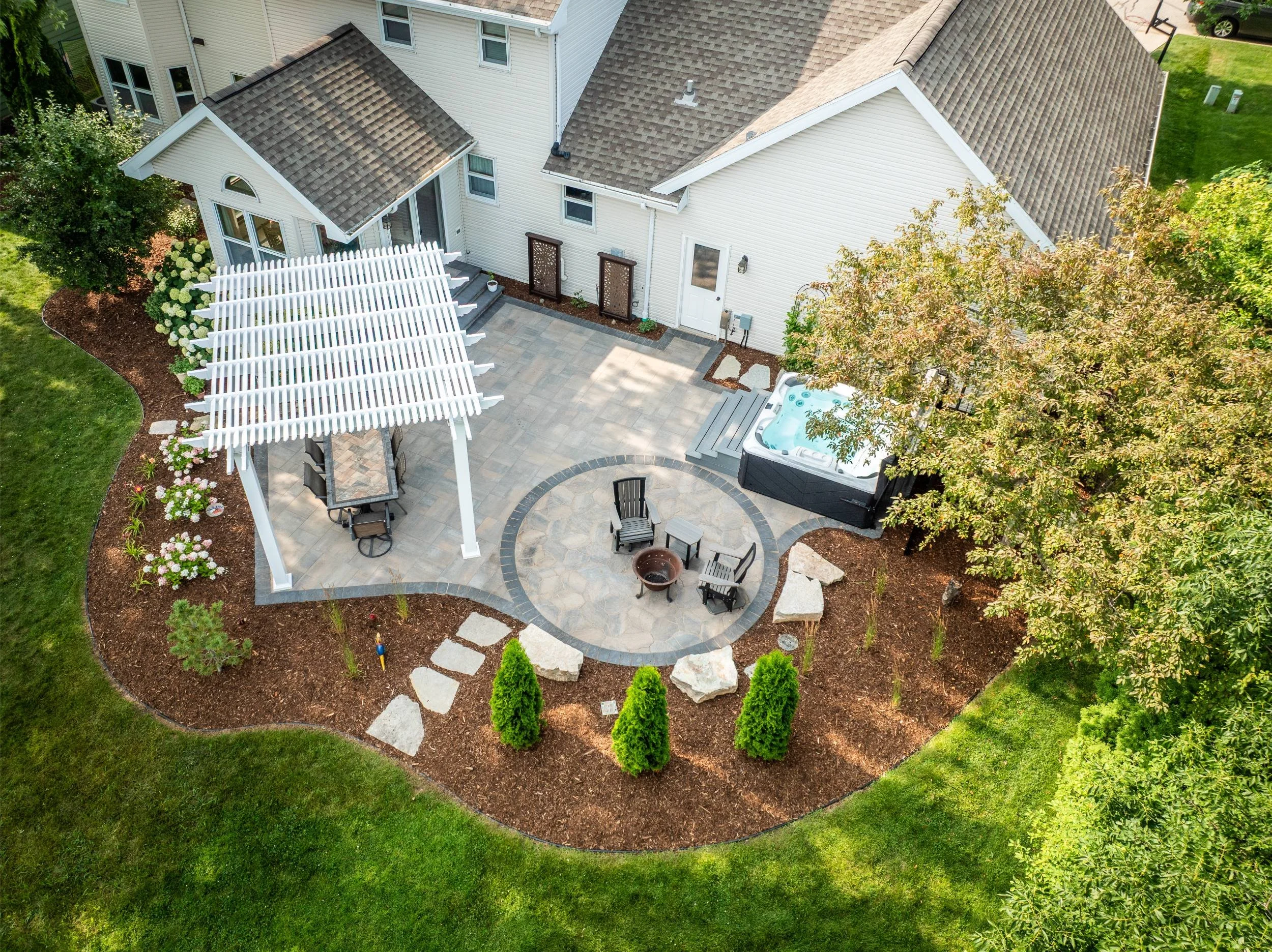 A beautifully designed pergola and seating area in the Fox Valley, WI
