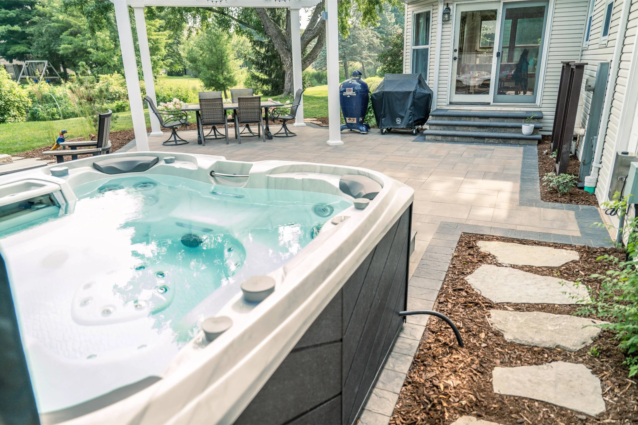 A multi-level Belgard paver patio with outdoor lighting in Green Bay, WI
