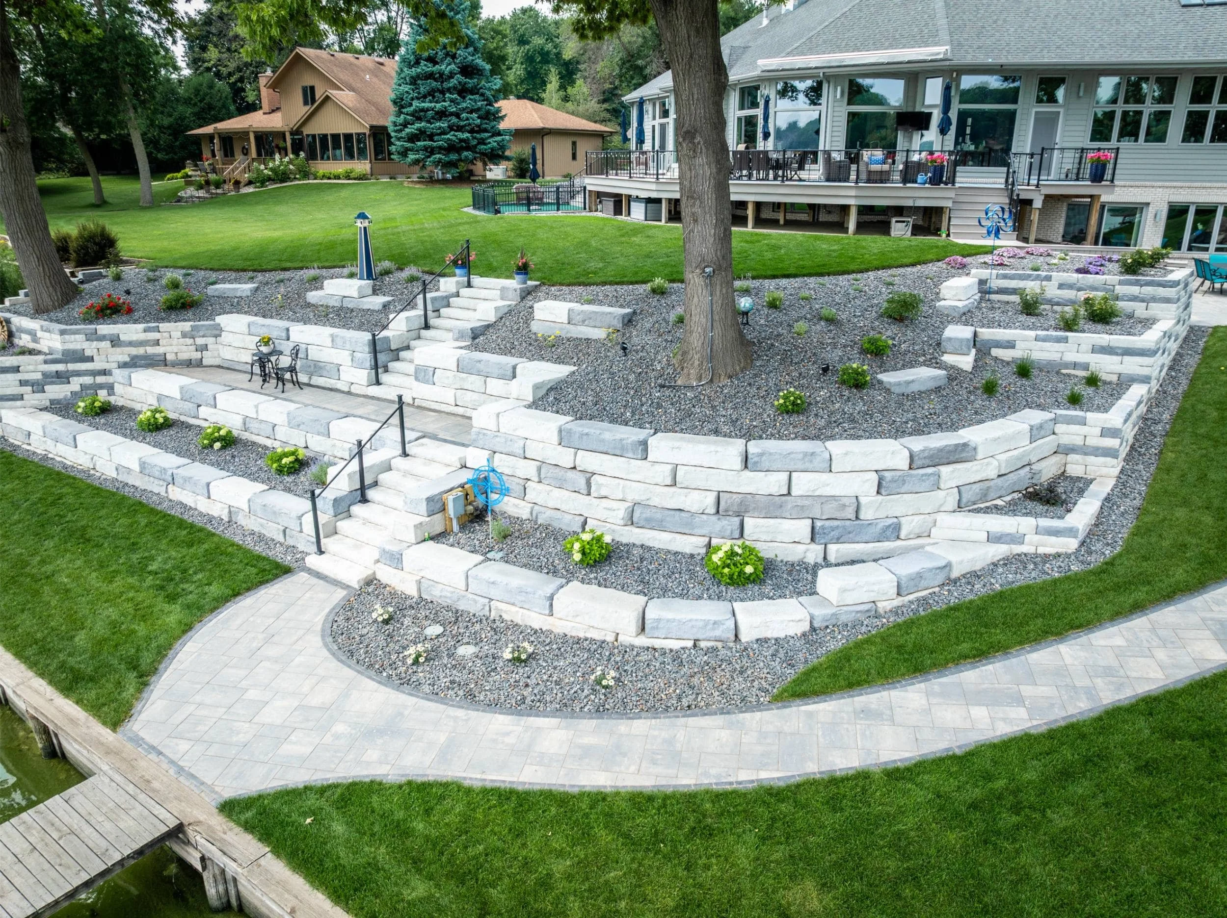 A custom waterfront design combining outdoor lighting and natural textures in the Fox Cities, WI