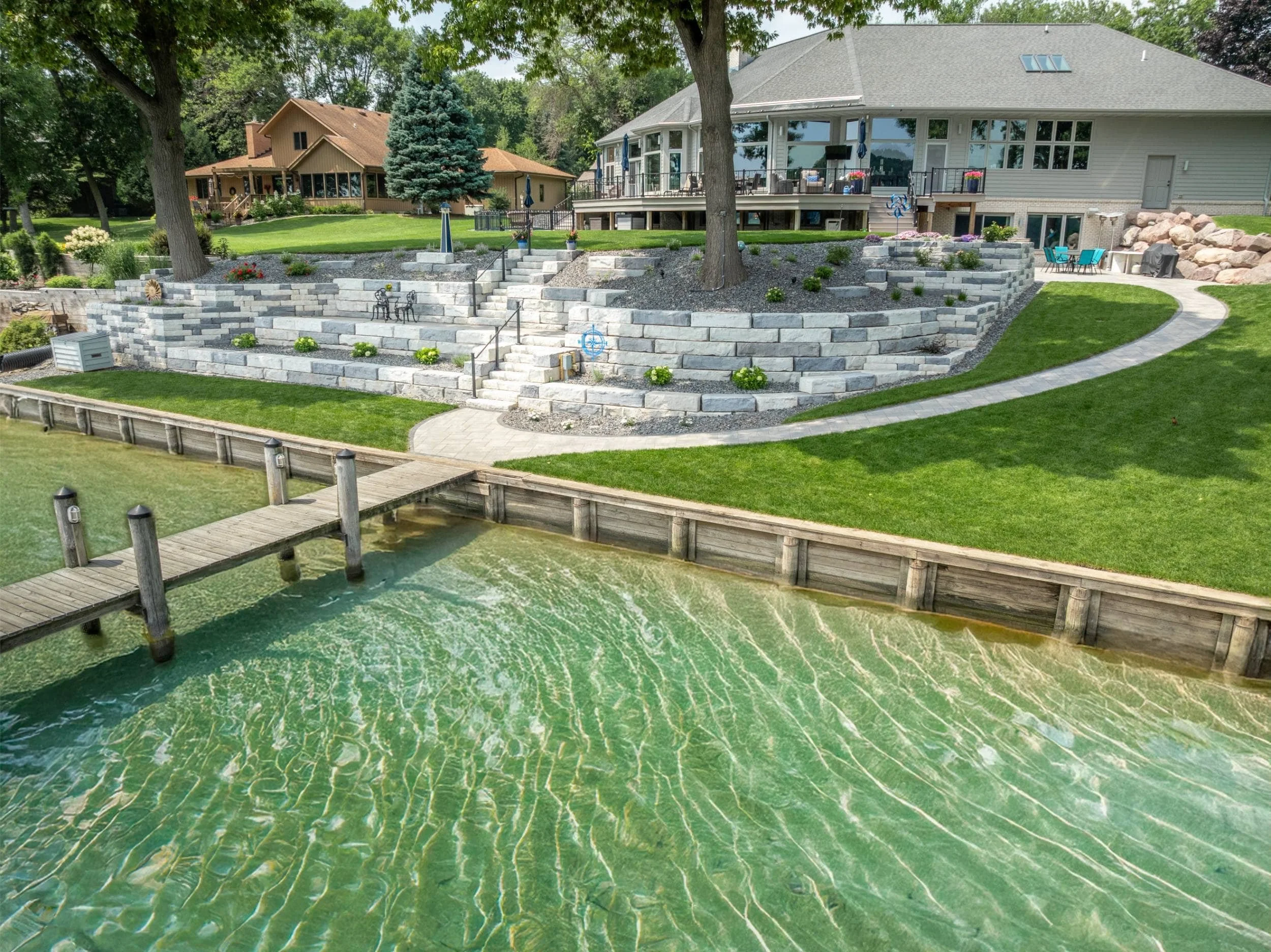 A scenic lakeside walkway accented by outdoor lighting in Greenville, WI