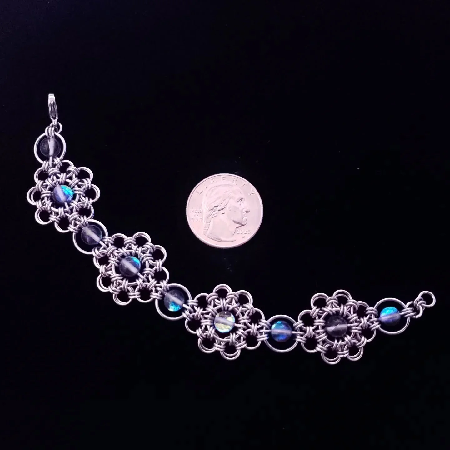 Stainless Steel and Mystic Aura Quartz beads.

#chainmaille #chainmaillejewelry #handmade