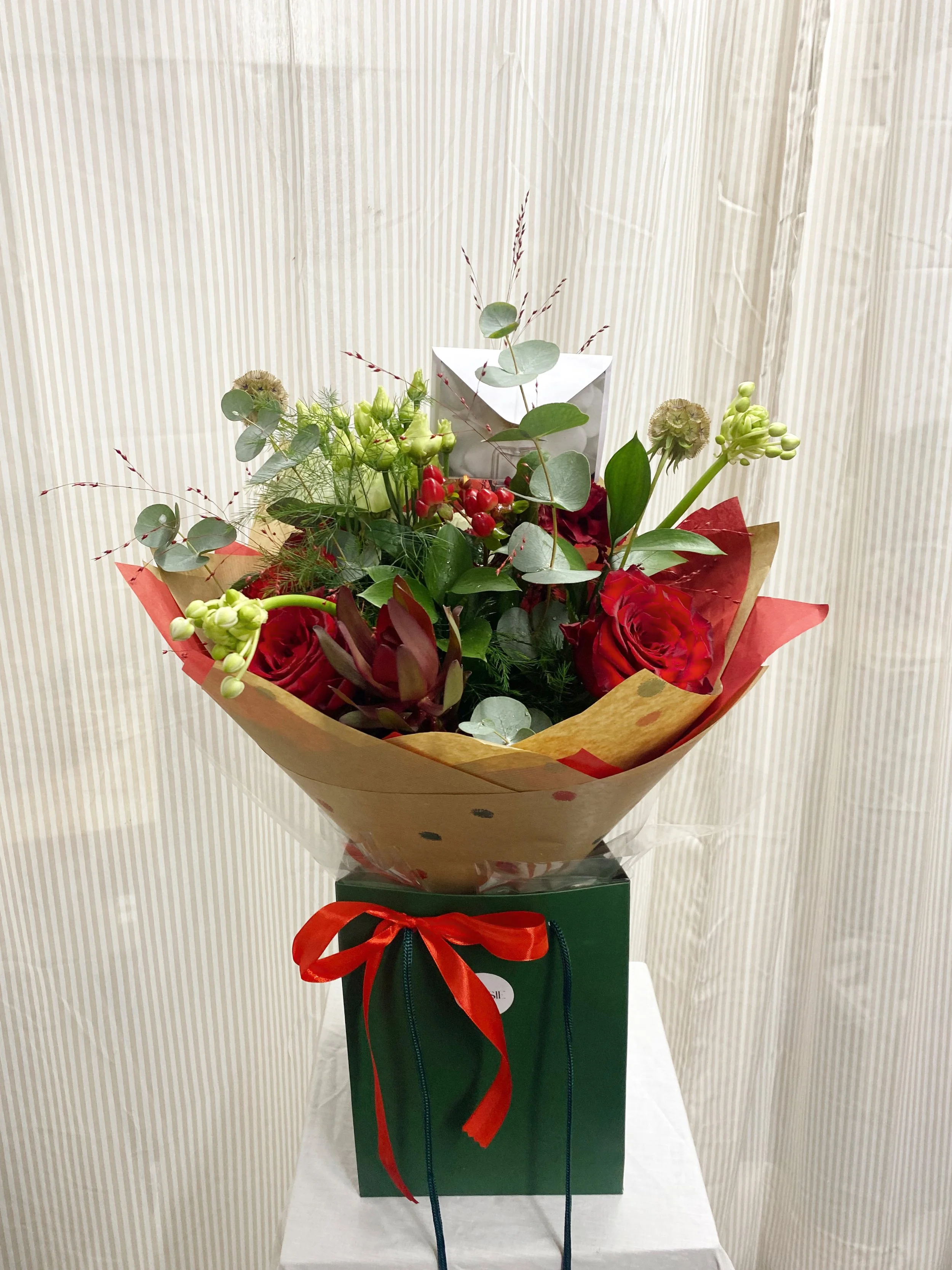 Christmas Reds Bagged Bouquet (PICK UP)