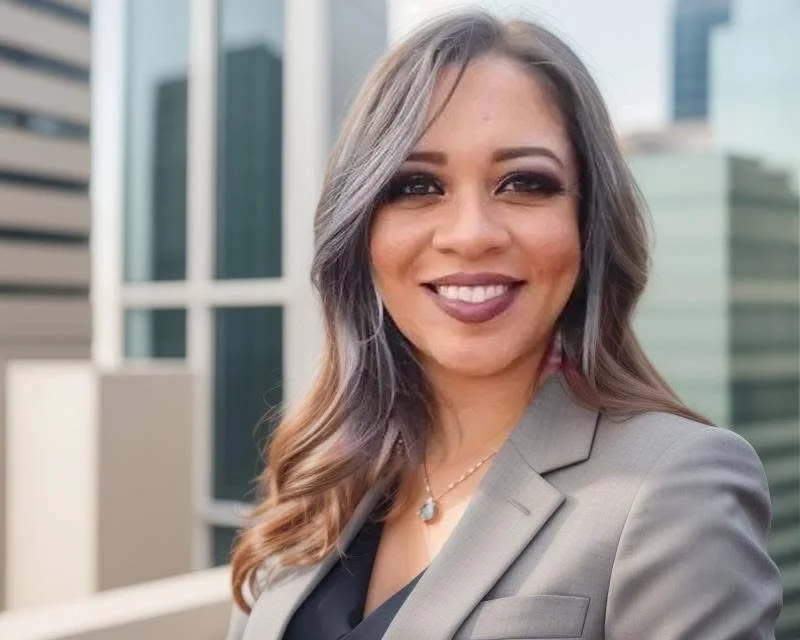 Woman in gray blazer in the city
