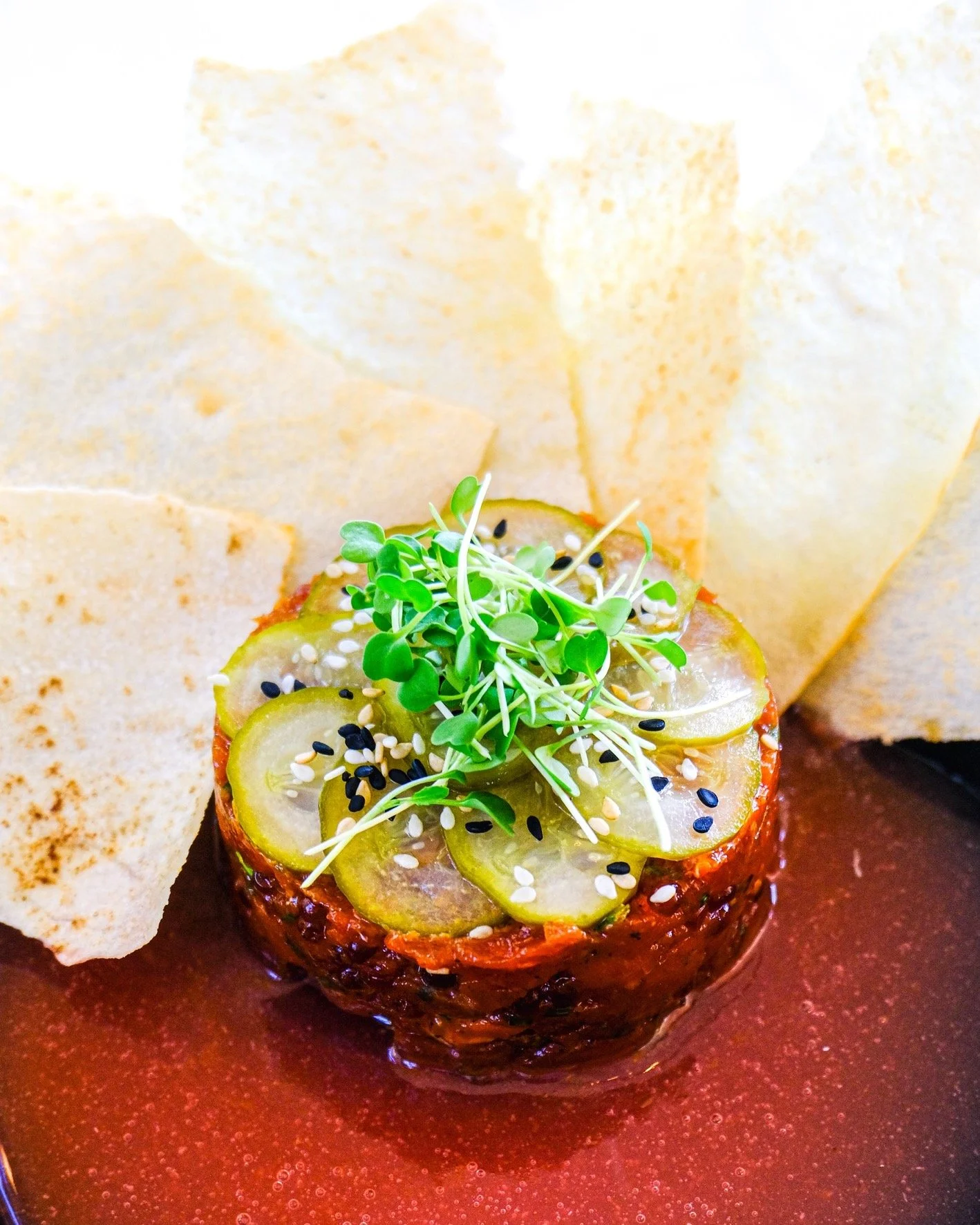 A fresh addition to the menu, our Chopped Yellowfin Tuna Crudo brings together vibrant citrus, delicate brininess, and a subtle touch of spice. Featuring trout roe, pickled Persian cucumber, and nduja spices, the dish is complemented by a blood orang