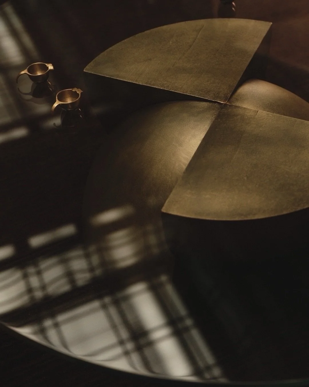 Axis Coffee Table. Opposing quadrants in cast brass, hand patinated by myself and finished with a 20mm clear glass top. All proudly made in England.
⠀⠀⠀⠀⠀⠀⠀⠀⠀
A happy accident of this shoot - the 1920s art deco ceiling of Battersea Control Room refle