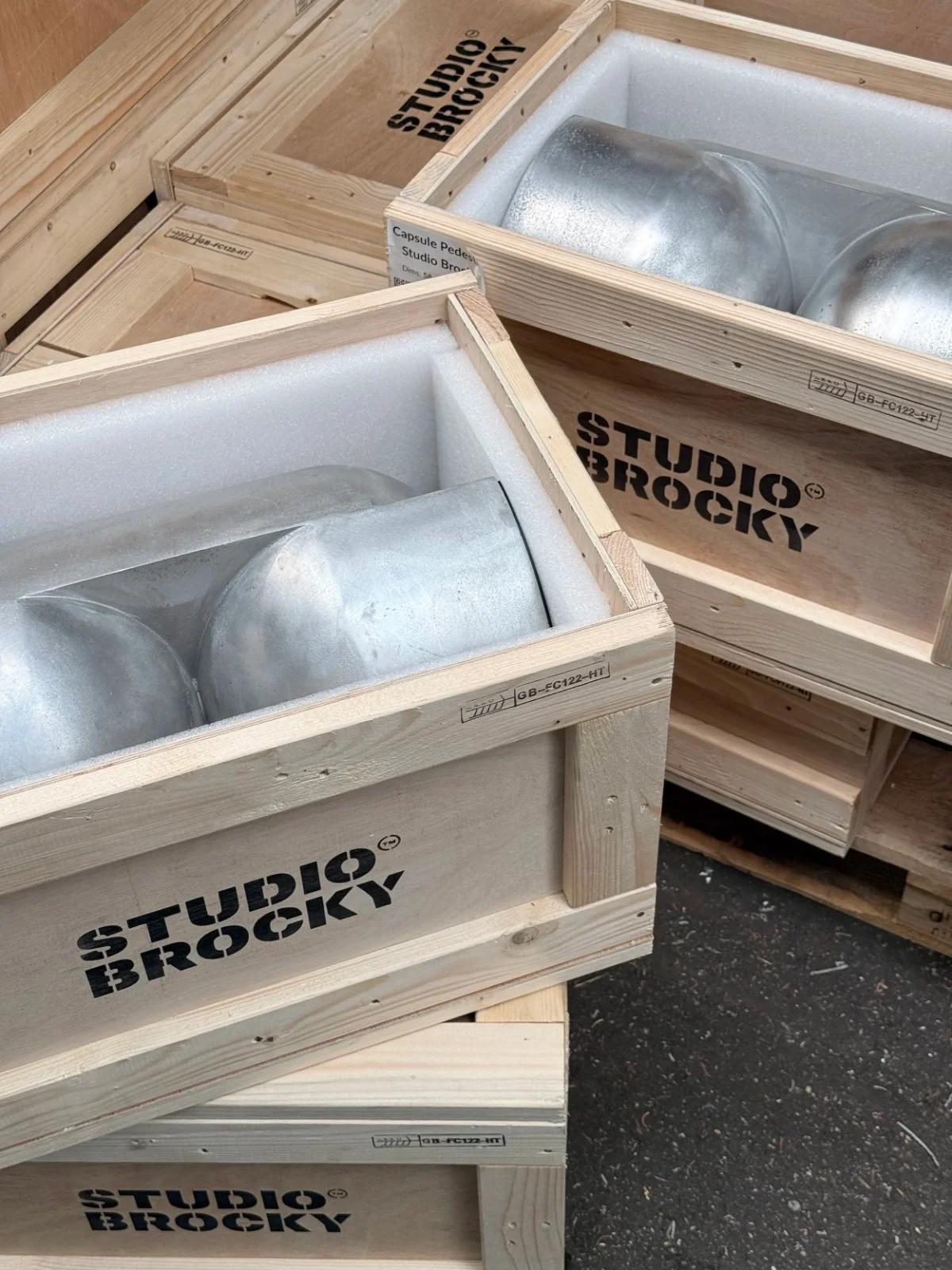 Sand cast aluminium pieces packed in Studio Brocky wooden shipping crates
