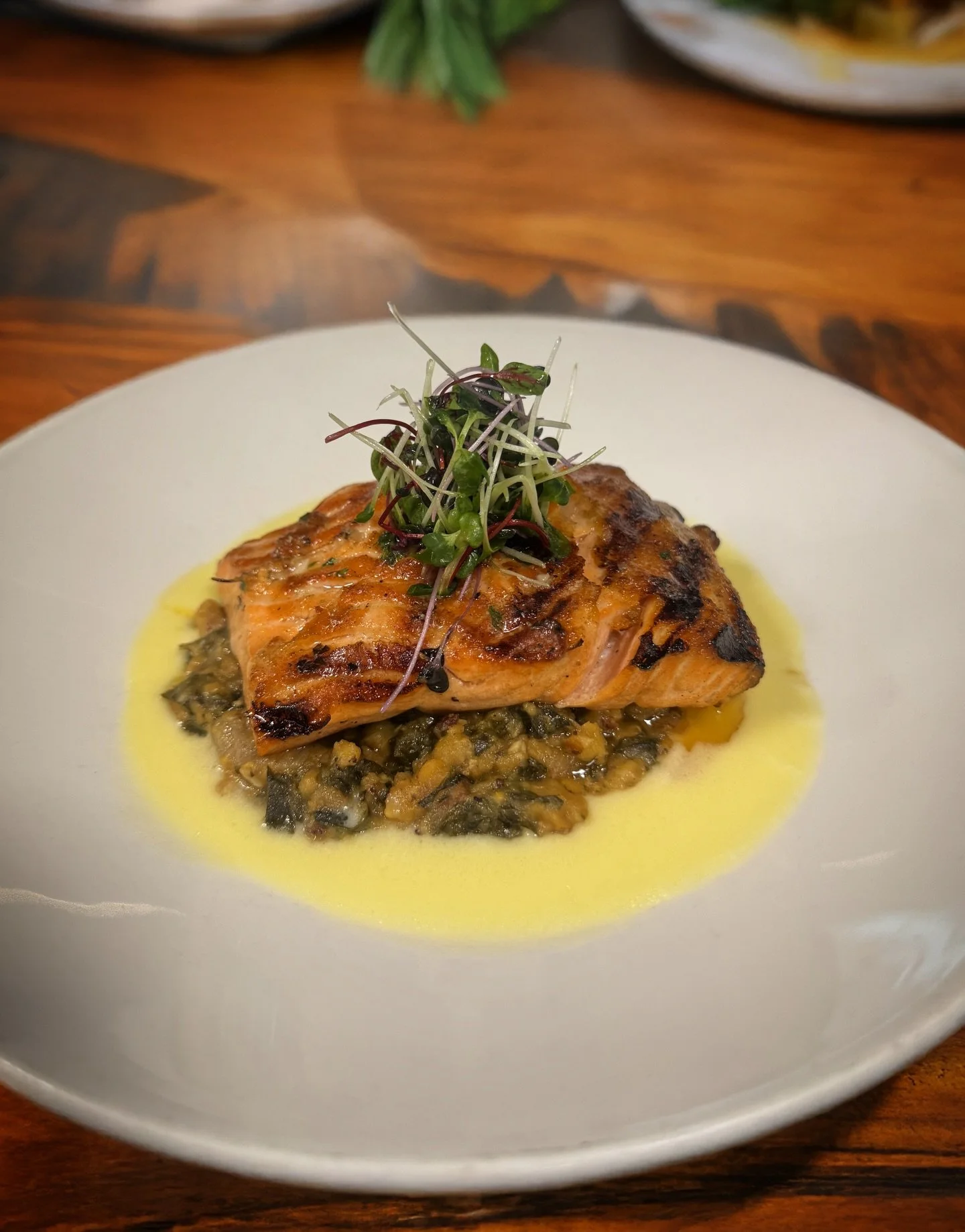 🚨 Introducing our newest Fresh Catch: Steelhead served over hearty red lentils, rainbow chard, and onions, finished with fresh micro-greens and savory notes of bacon and andouille.

🌱🐟 It&rsquo;s comforting, vibrant, and crafted just for the seaso