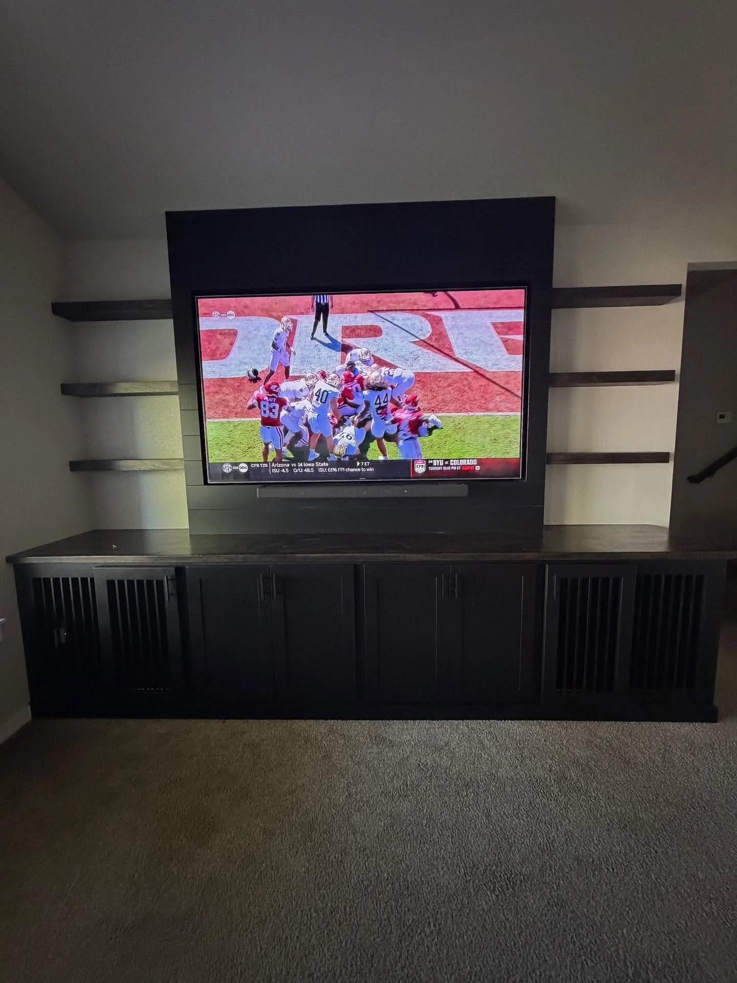 This build has a little something for everyone in the family, even the fur babies!! 
This stunning TV entertainment center is packed with tons of features including recessed shiplap to encase the TV beautifully, custom built dog kennels; shaker cabin
