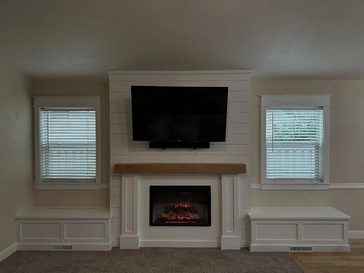 WOW!!! This build is on fire!! 
This gorgeous 100% custom built fireplace is a showstopper. From the custom built shiplao wrap, to the stunning craftsman window seats to the breathtaking wood mantle. This space has a whole new feel with instant charm