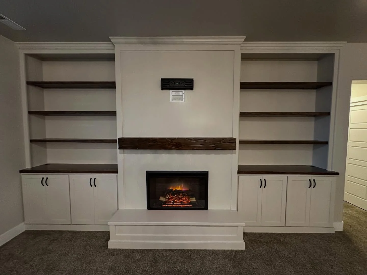 This home is ready for the holidays!! 
From a blank wall to pure perfection! This 100% custom built craftsman style fireplace paired with a hearth, built in cabinets, bookshelves and a stunning wood mantle. Give the space just the right amount of coz