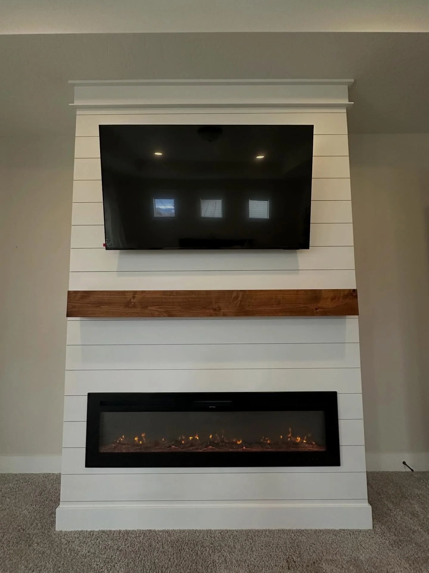 This primary bedroom fireplace is even more gorgeous in person! Giving the space so much purpose, character, warmth and the coziest feel! 100% custom built and beautifully finished. This shiplap wrapped fireplace is paired with a gorgeous knotty alde