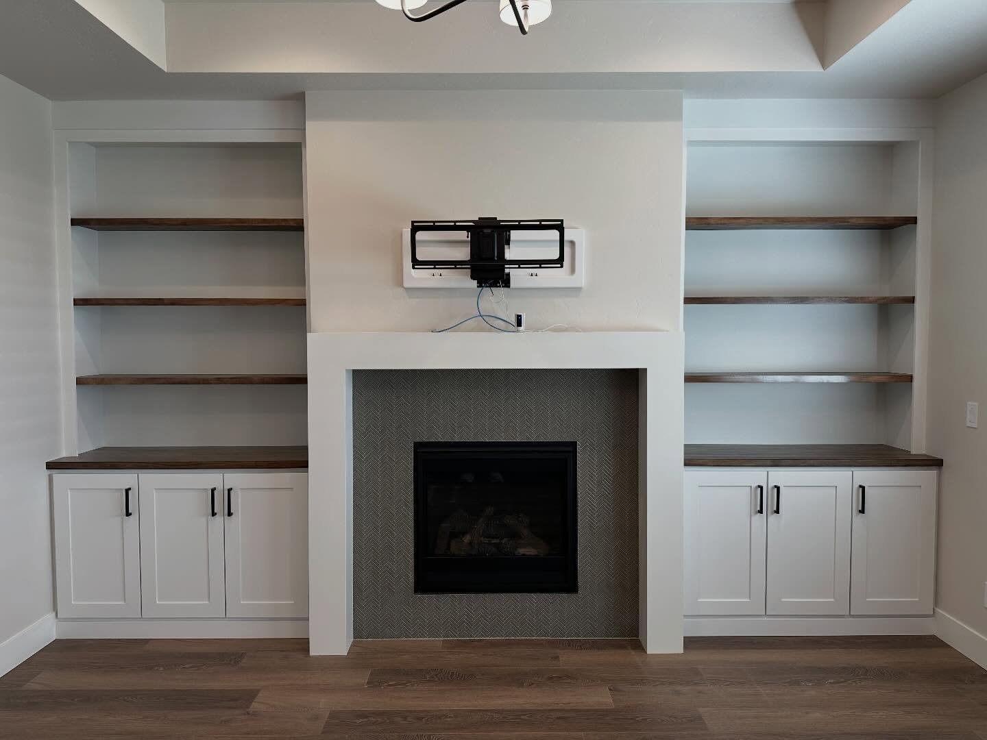 A gorgeous build that looks like it should have always been there!! This 100% custom built fireplace build out is a dream for storage, character and design! Built and finished to last!! Taking this living room from builder grade to extraordinary! 

#
