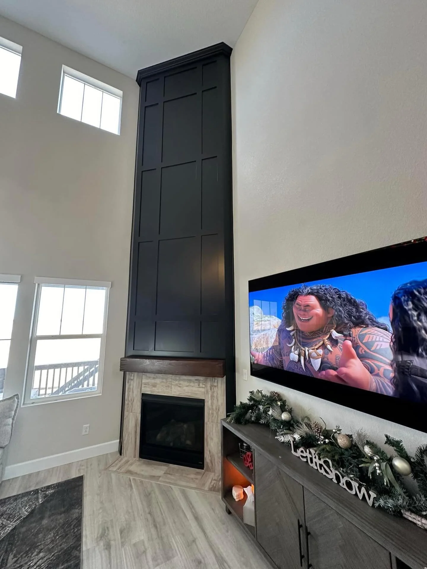 When the addition of board + batten brings a timeless finish to an already beautiful space! This two story fireplace is such a stunning statement wrapped in a beautiful custom built board + batten that shows off the height and gives the space an inst