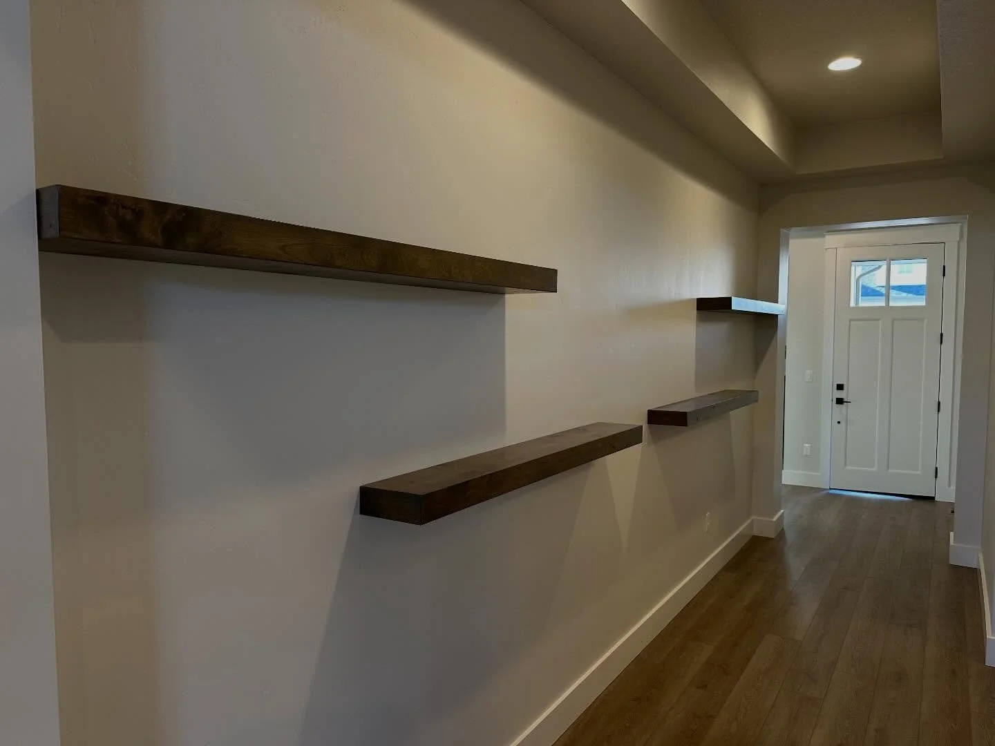 When natural wood floating shelves make an incredible impact!! Check out these custom built floating shelves. Color matched to perfection to highlight this stunning entry way! 

#meridianidaho #cranecustoms #localcarpenter 
#finishcarpenter #custombu