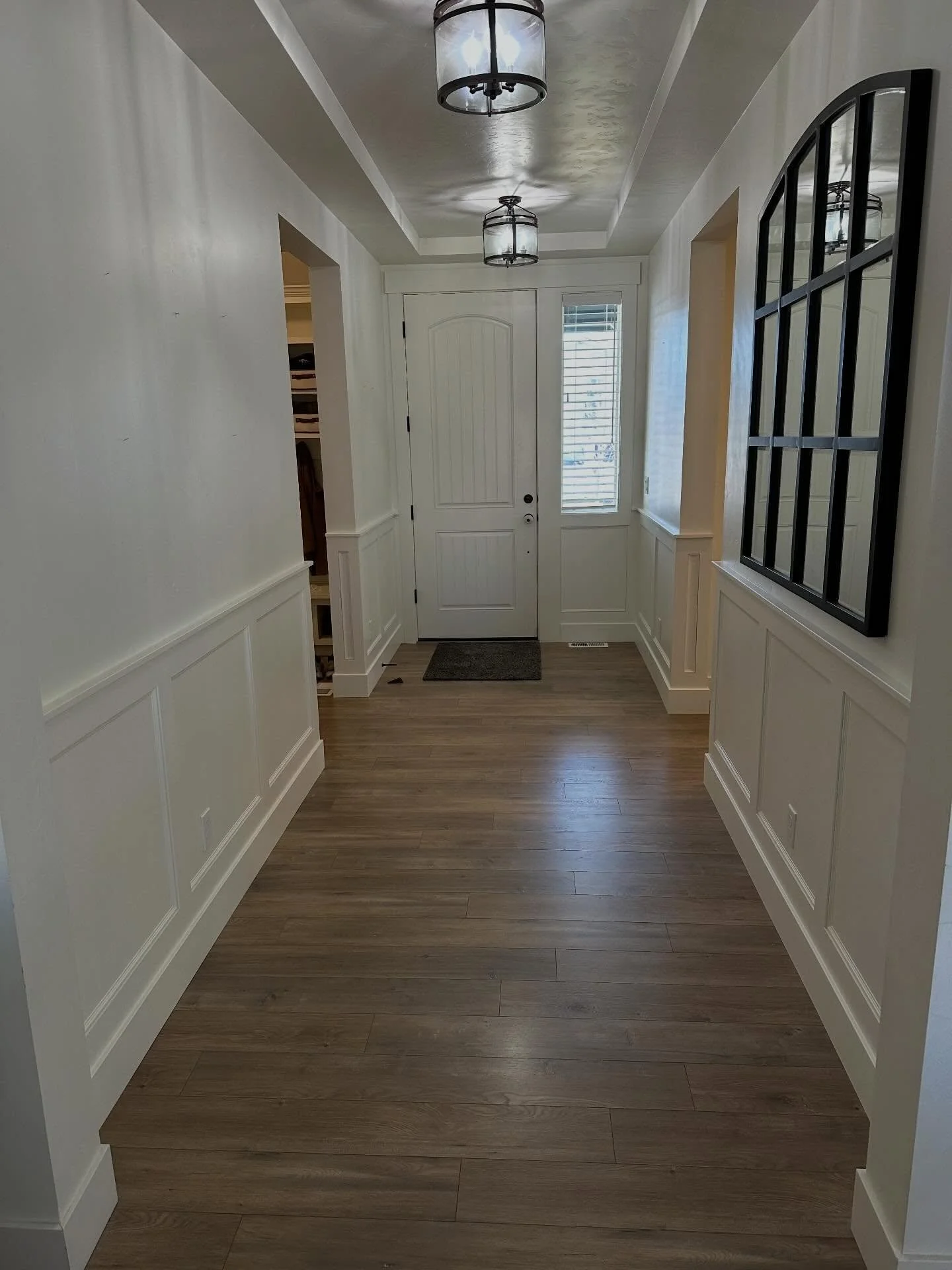 Every entry way needs wainscoting! Check out this absolutely stunning addition, changing this entry from your every day builder look to a gorgeous and inviting entrance!! 

#meridianidaho #cranecustoms #localcarpenter 
#finishcarpenter #custombuiltin