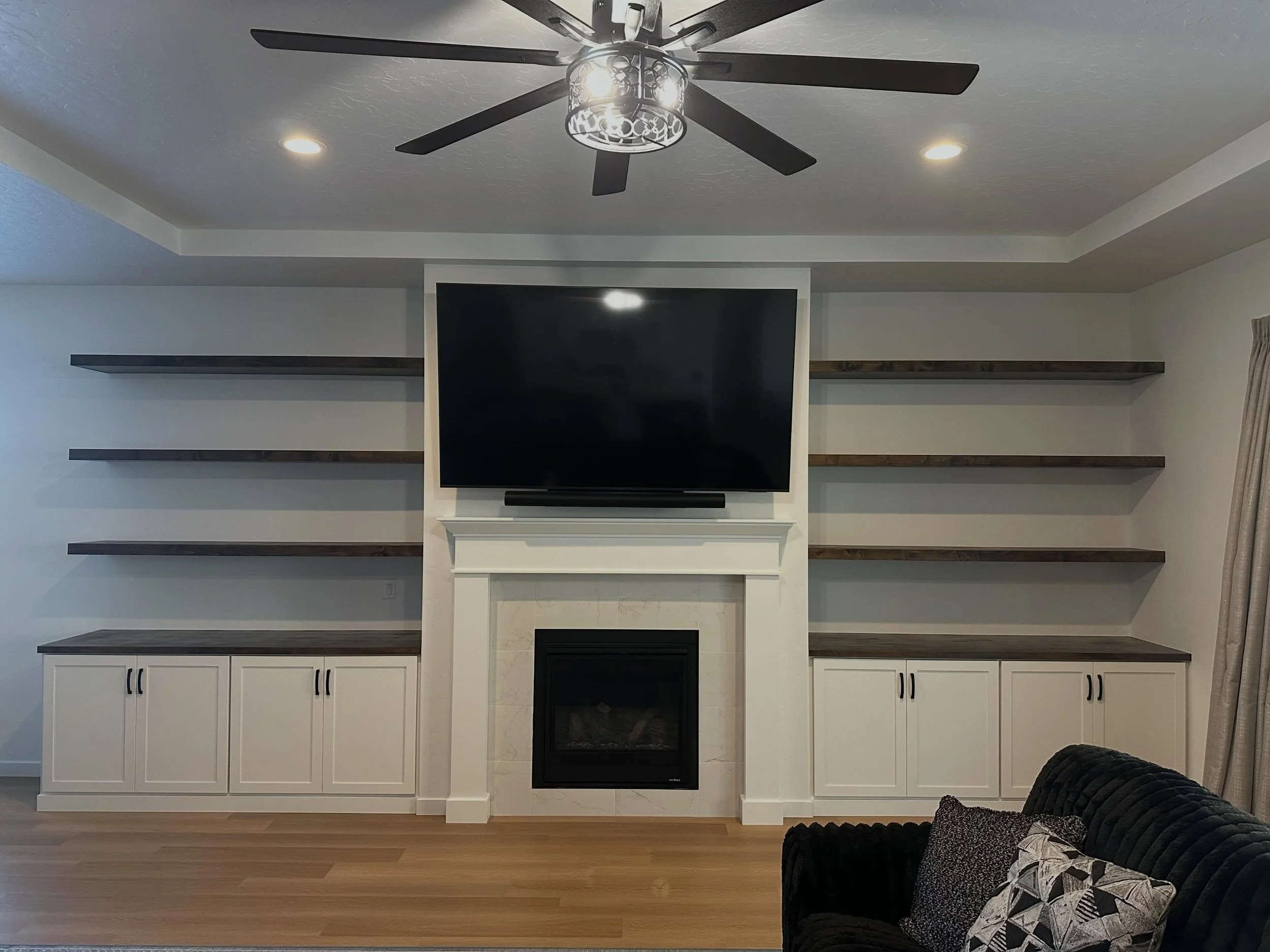 A timeless update that makes a huge impact!! 
Custom built for the perfect fit and finish. These shaker style cabinets with a gorgeous natural wood topper and matching floating shelves give this whole space a new purpose!! Adding instant design, dept