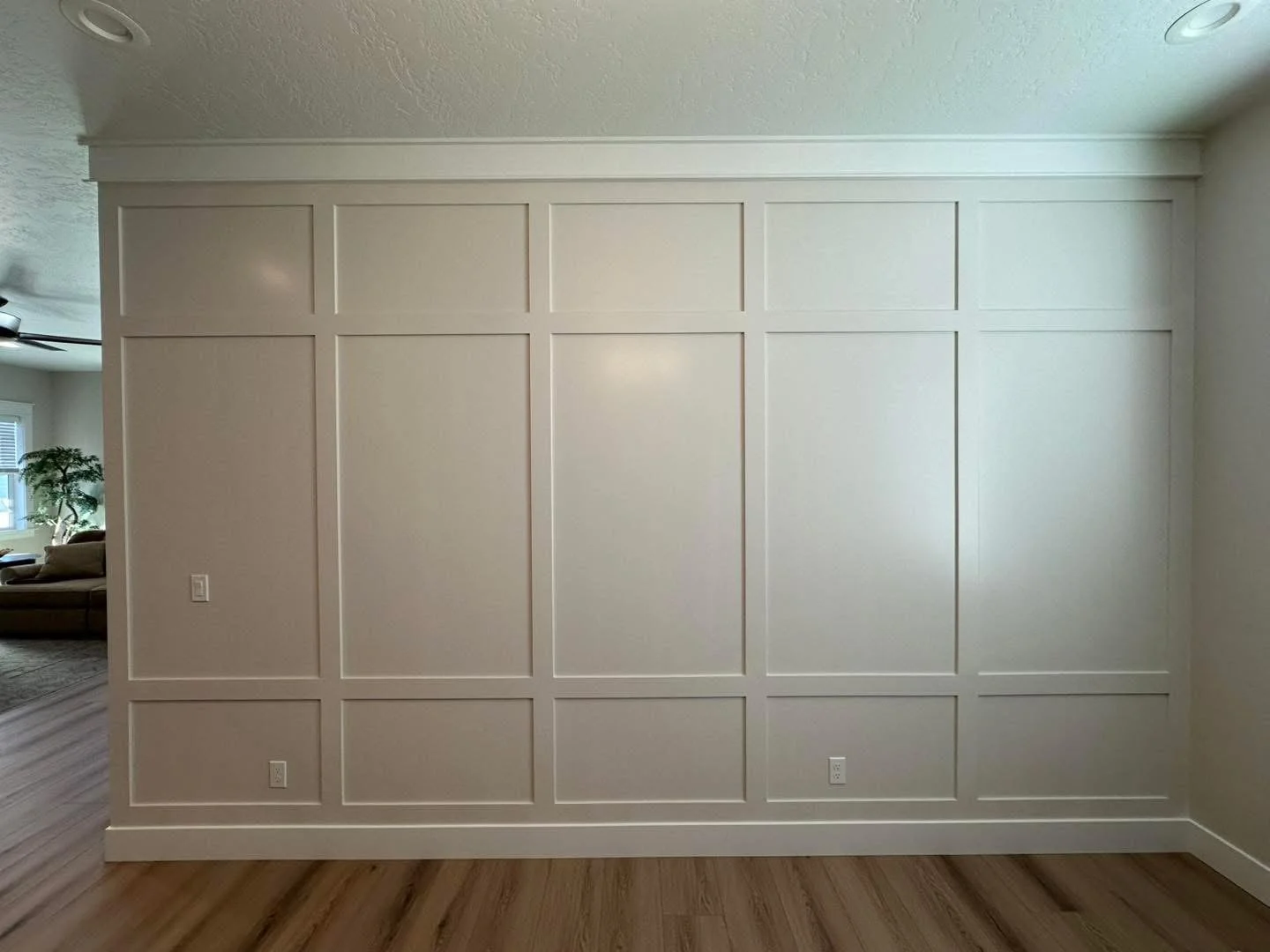 Custom board and batten wall design adding architectural character to a Meridian, Idaho dining room.