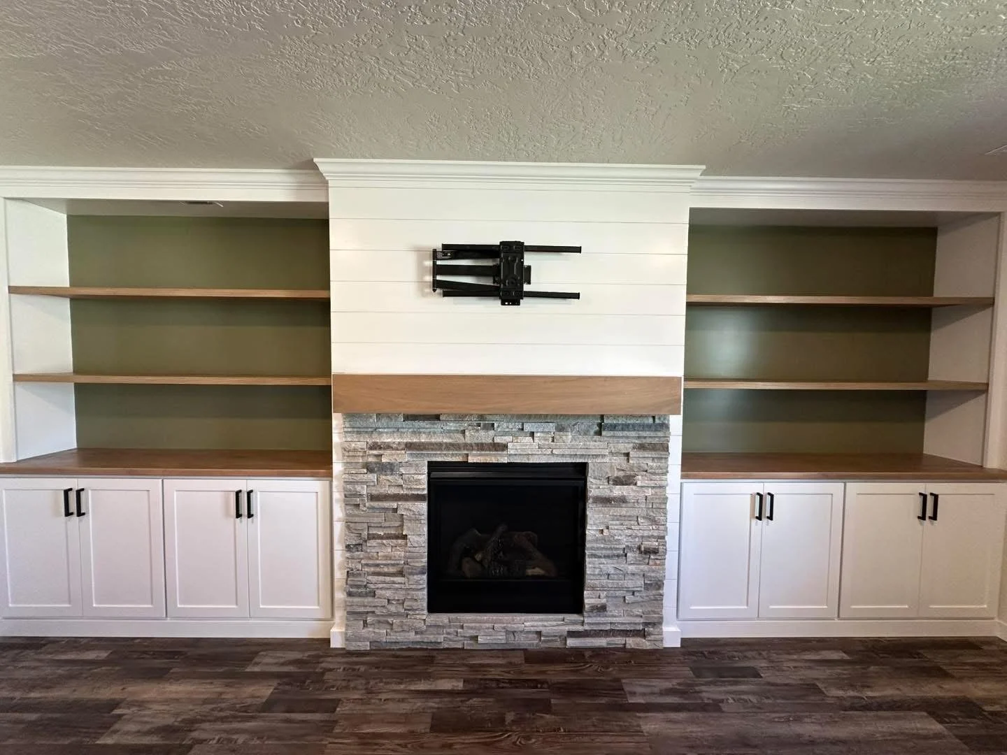 White custom entertainment center with fireplace built-ins in Meridian, Idaho.