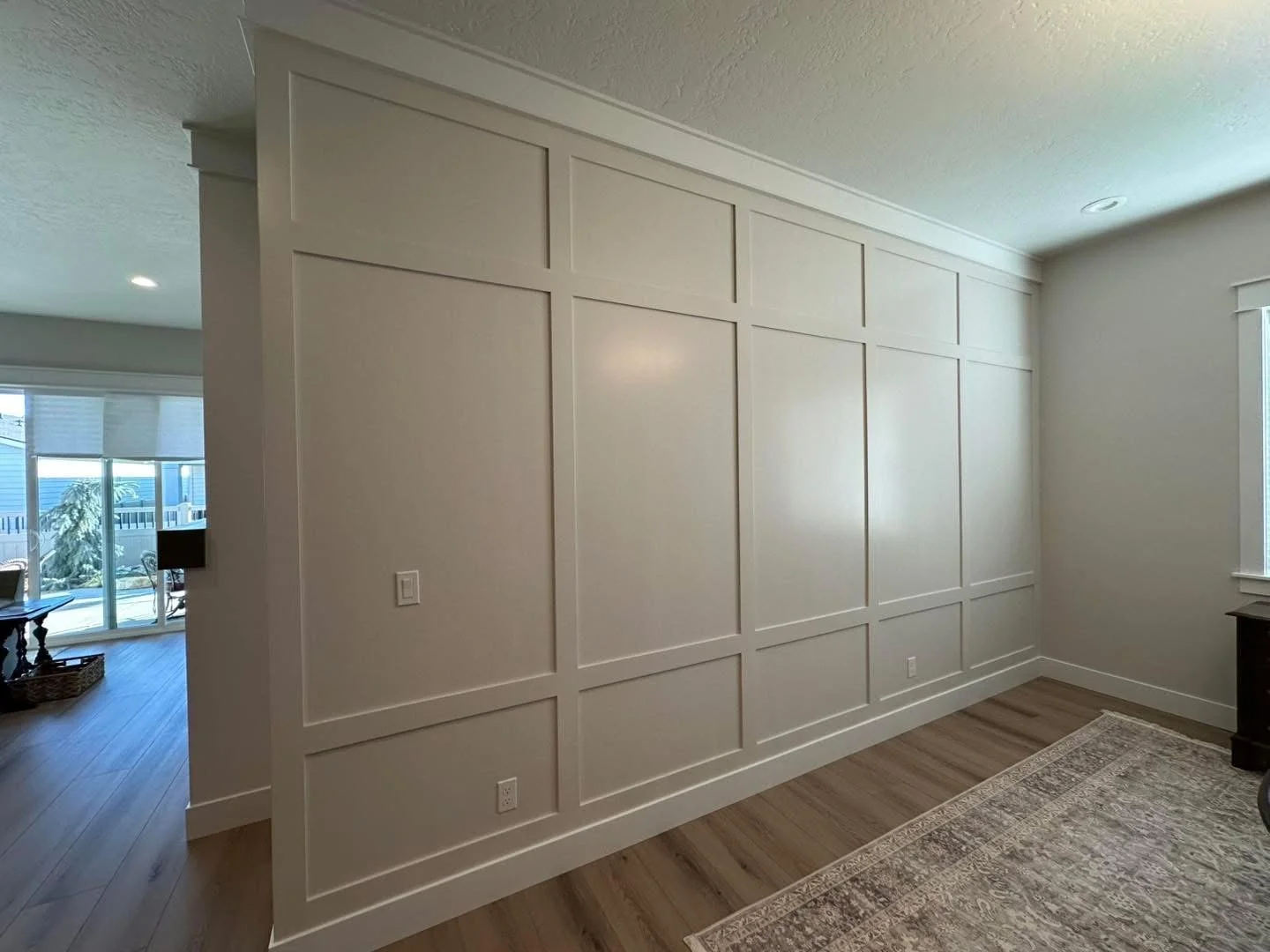 Modern full-height board and batten feature wall creating architectural detail in a Meridian, Idaho home.