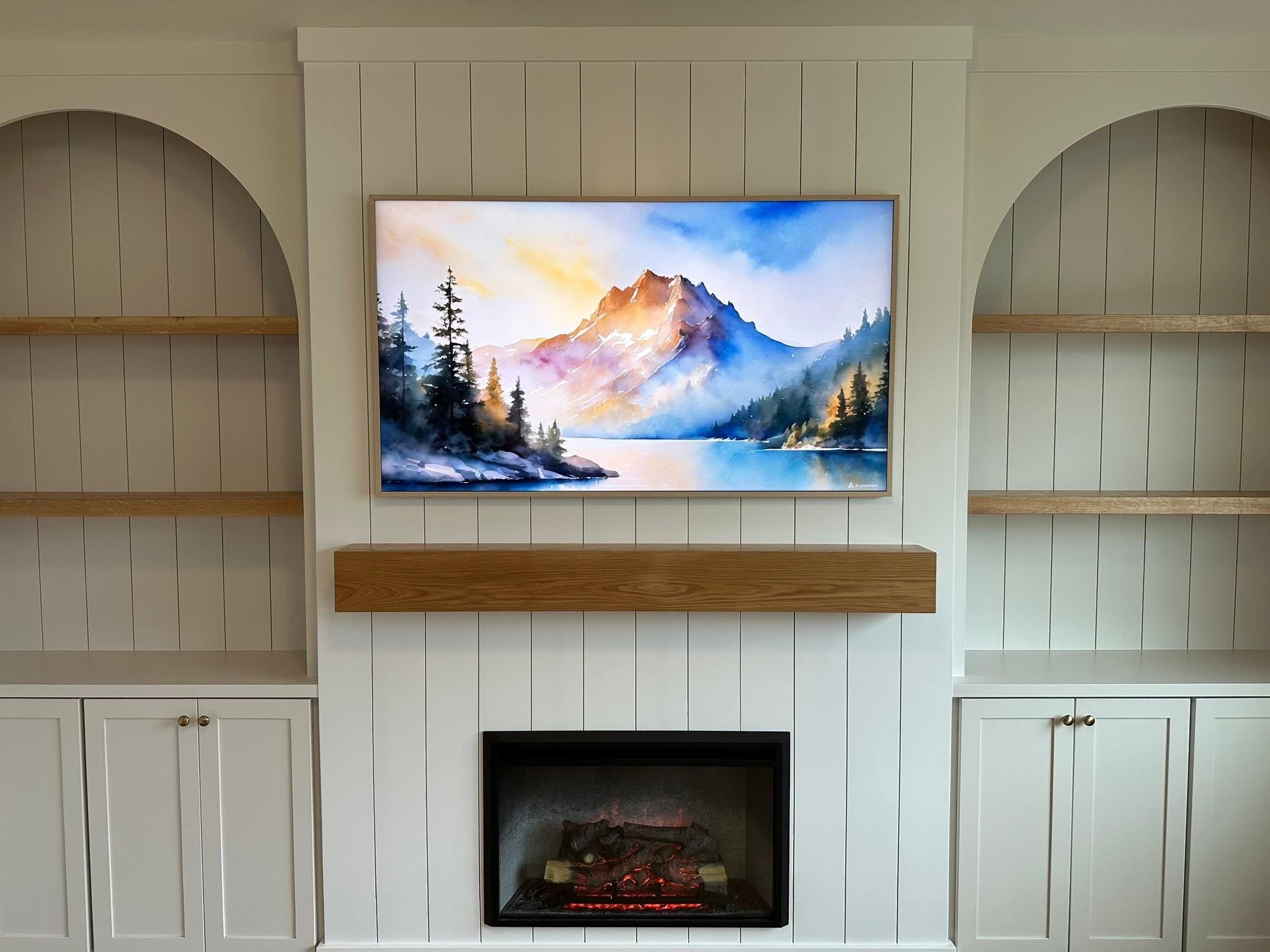 Shiplap fireplace feature wall with a floating wood mantel and custom entertainment center in a Meridian, Idaho home.