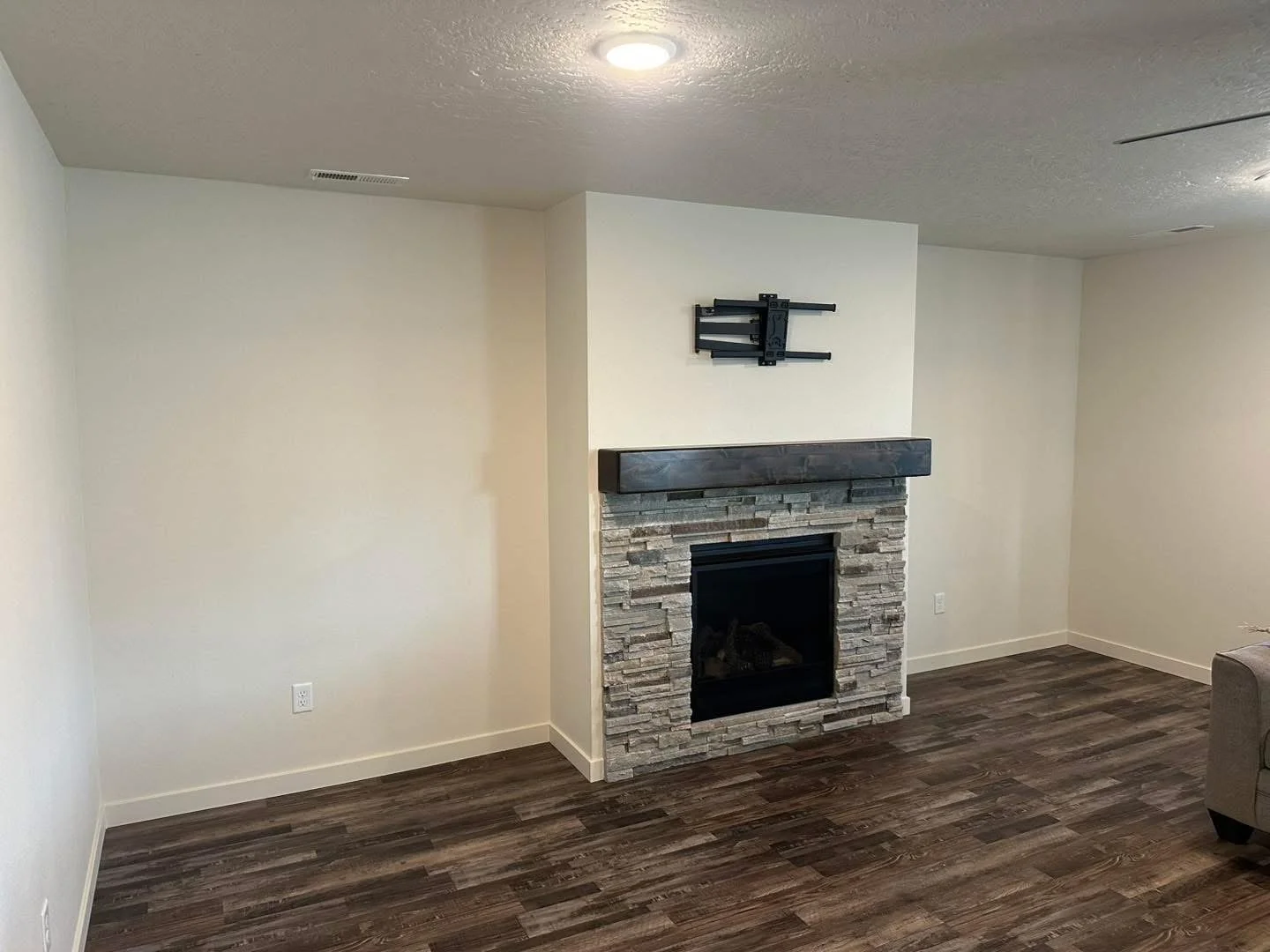 Fireplace before custom cabinetry and built-in shelving were installed.