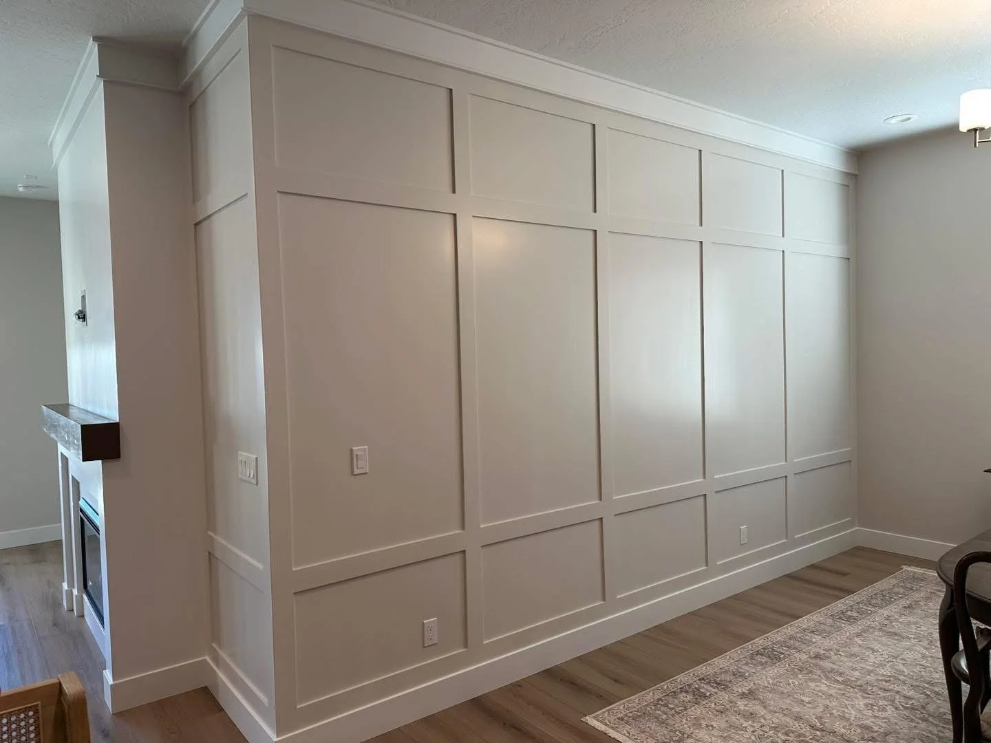 Custom floor-to-ceiling board and batten accent wall installed in a Meridian, Idaho dining room.