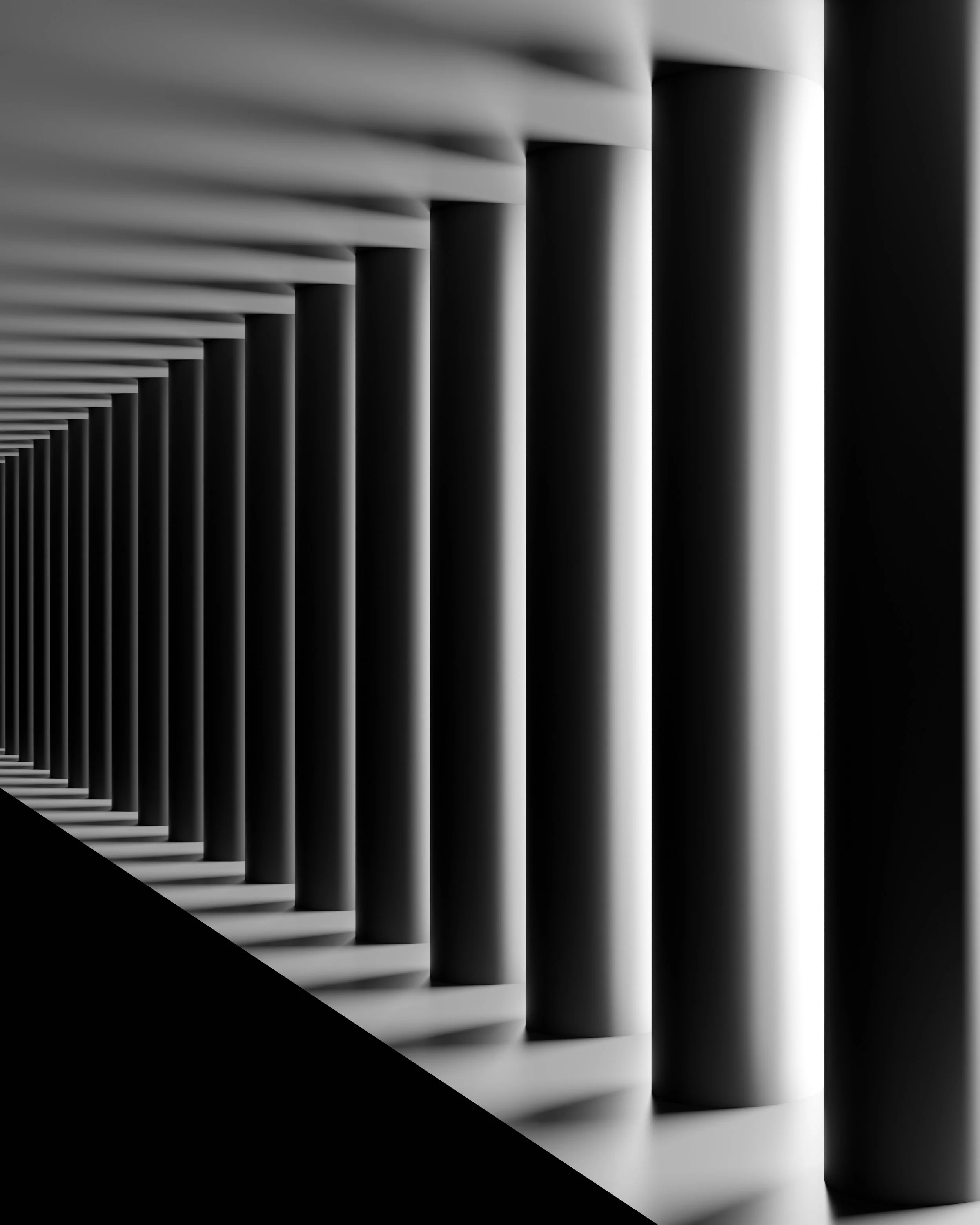 Une rangée de colonnes verticales en noir et blanc dans un bâtiment moderne, avec un jeu d'ombres et de lumières.