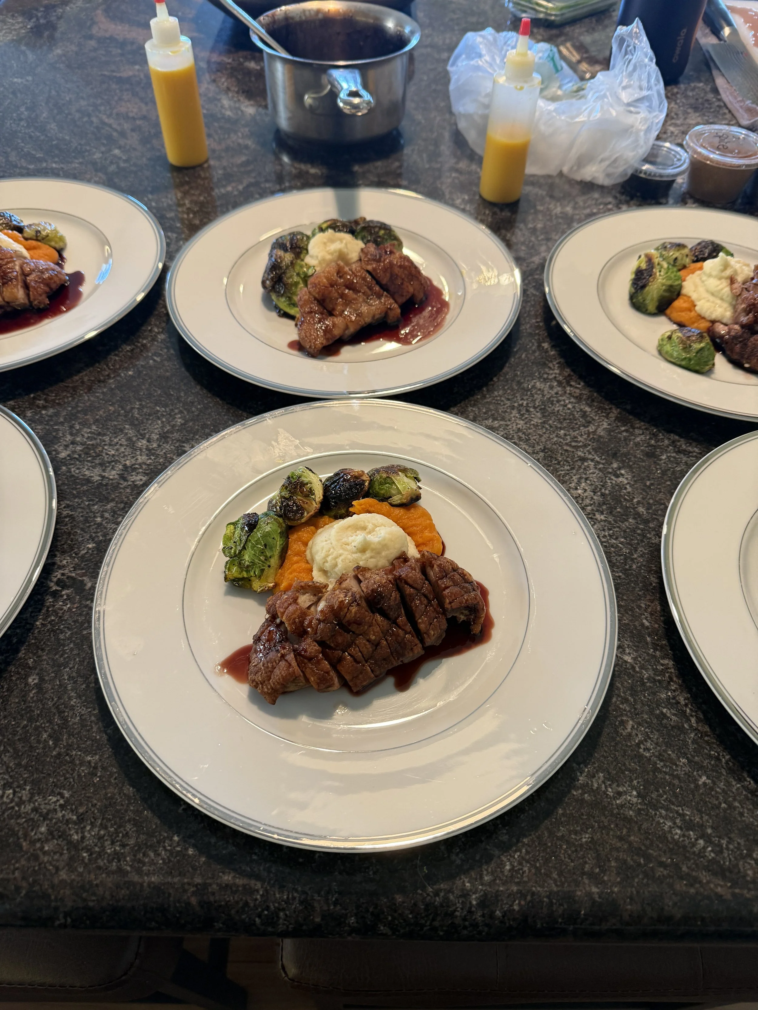 Seared duck breast, parsnip and sweet potato purée , Brussels sprouts, pomegranate Demi .