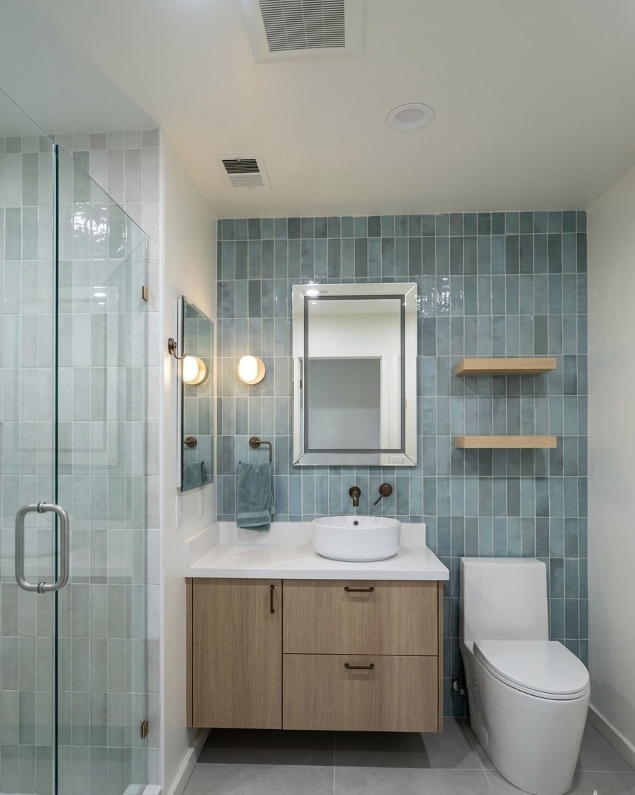 blue bathroom tile with wood vanity