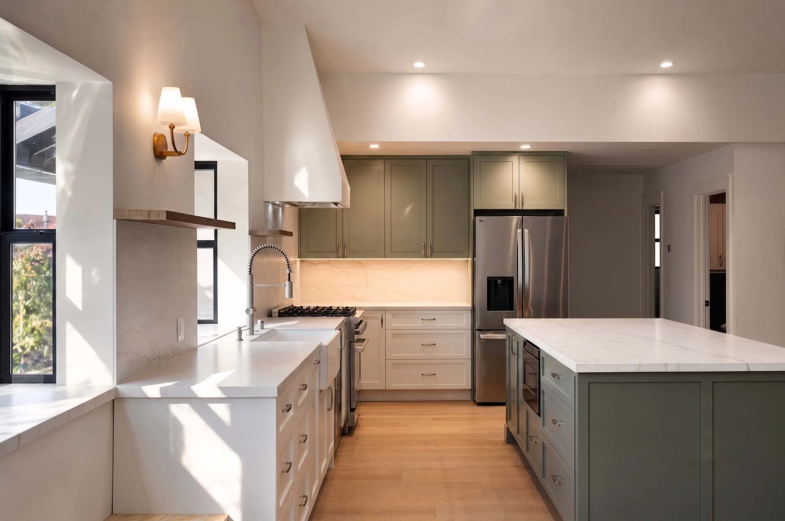Sage green and white kitchen