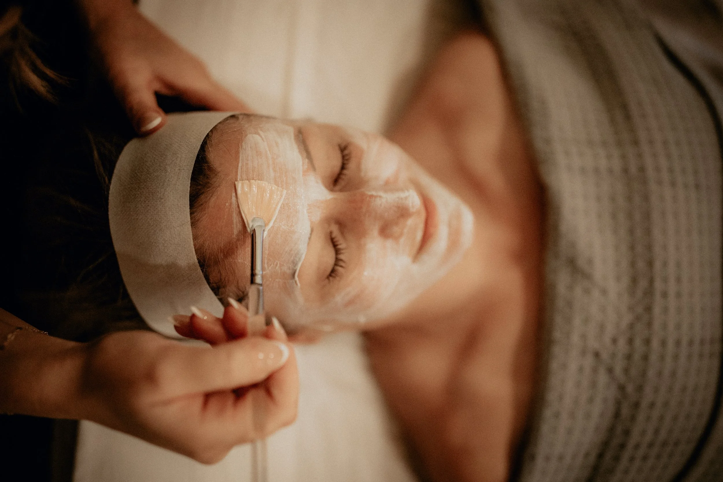 Image of woman in spa bed getting a facial