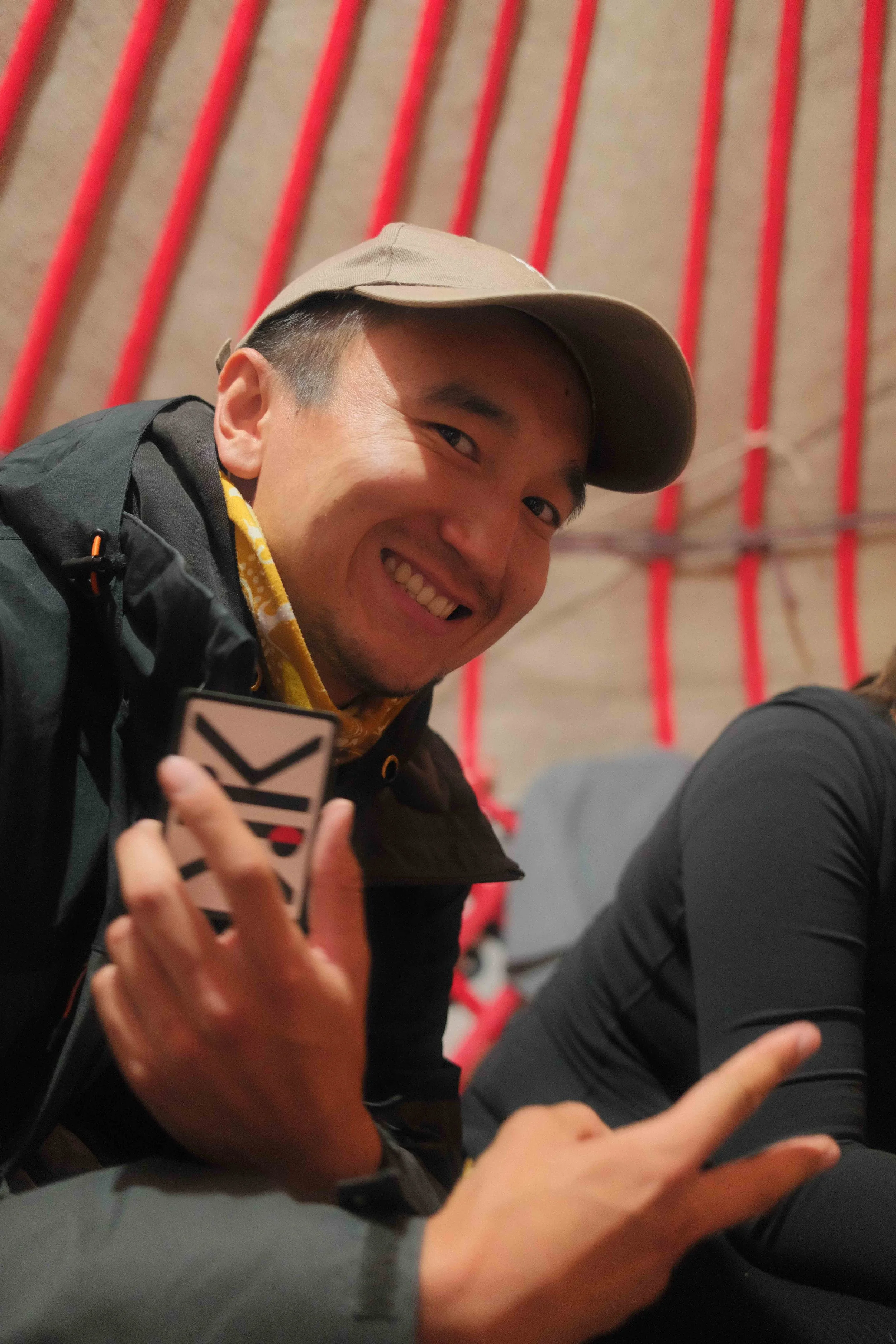 Guests sharing moments in a traditional Kyrgyz yurt