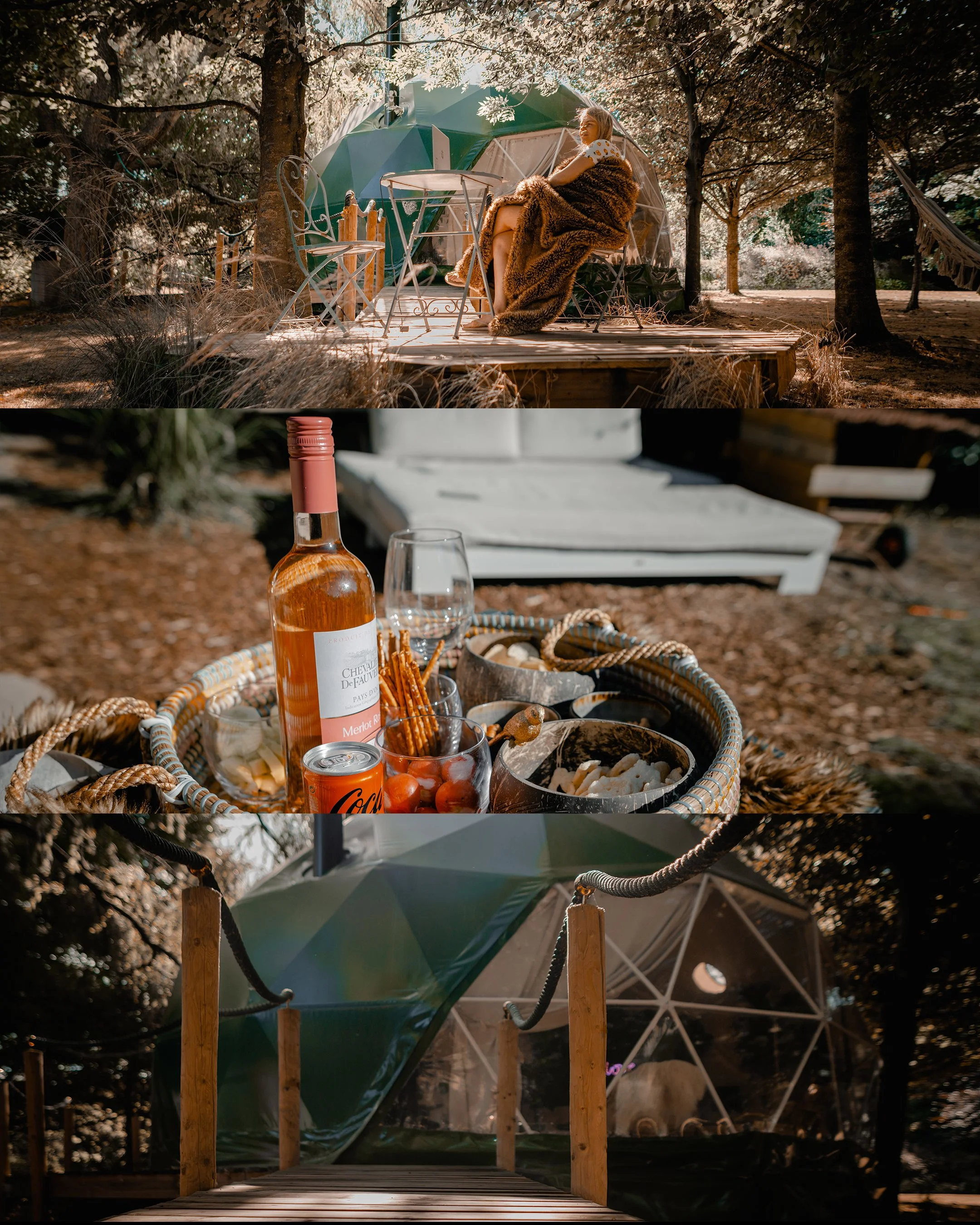 A woman sitting on a chair outside a geodesic dome tent, surrounded by trees and nature, with a folding table and picnic setup, and a transparent geodesic dome with a dog inside.