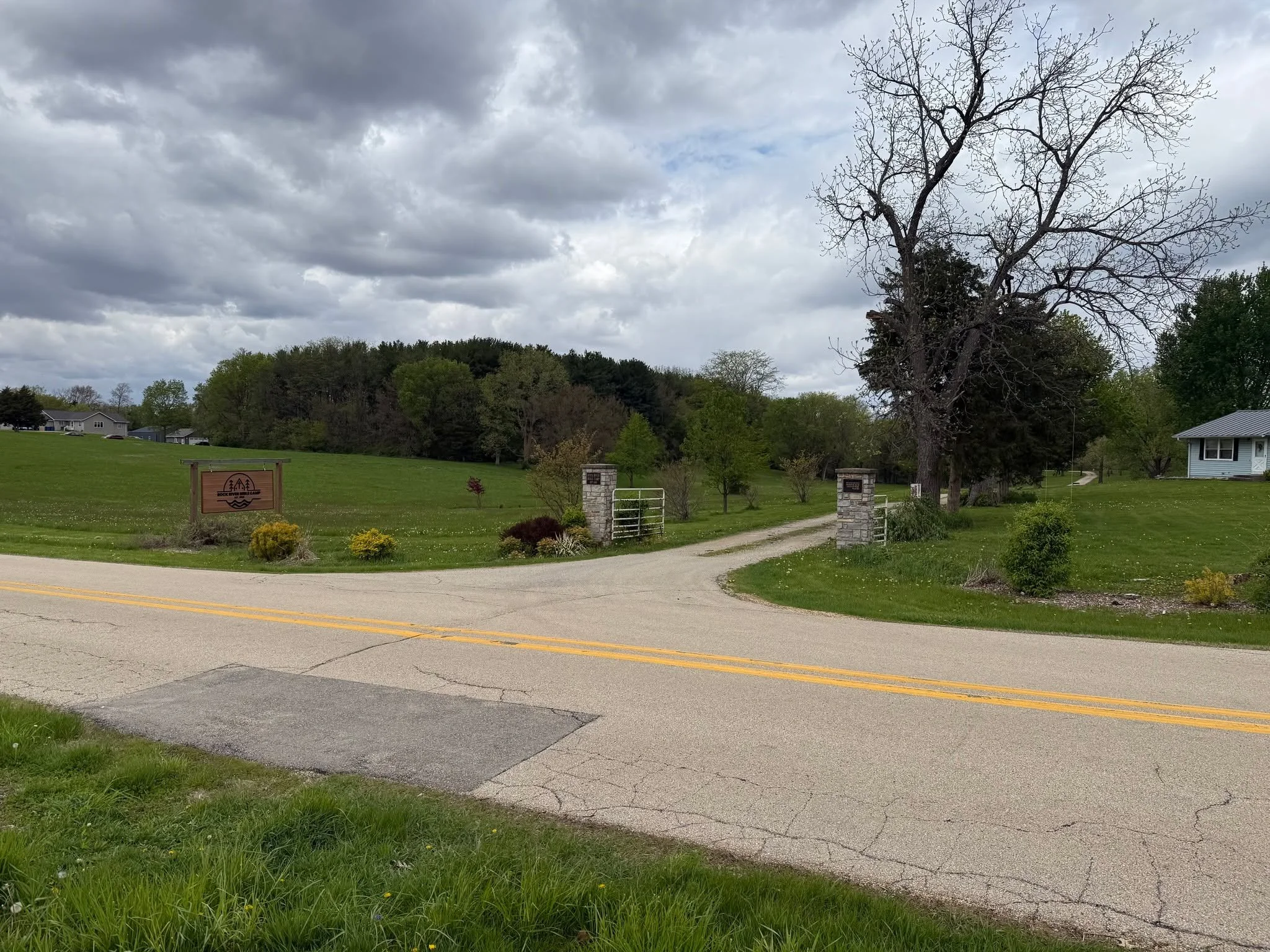 The entrance to camp is looking a little different today. Recent weather caused damage to the fence meaning it had to be removed. 
On the plus side there's less to mow around at the moment and you can really see our sign now!
