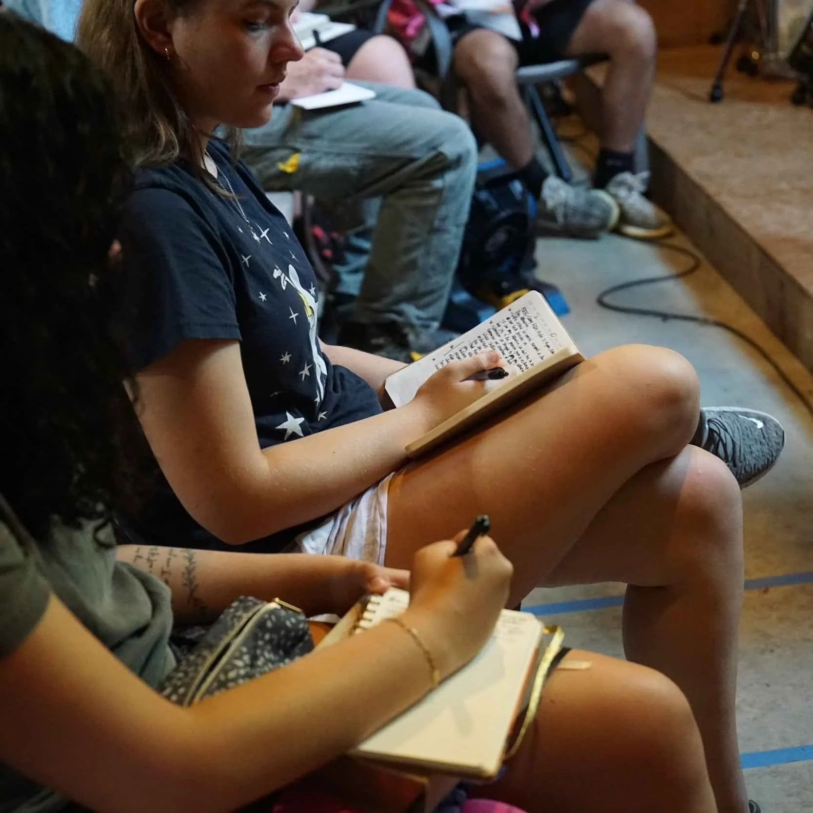 RRBC senior campers taking notes in chapel