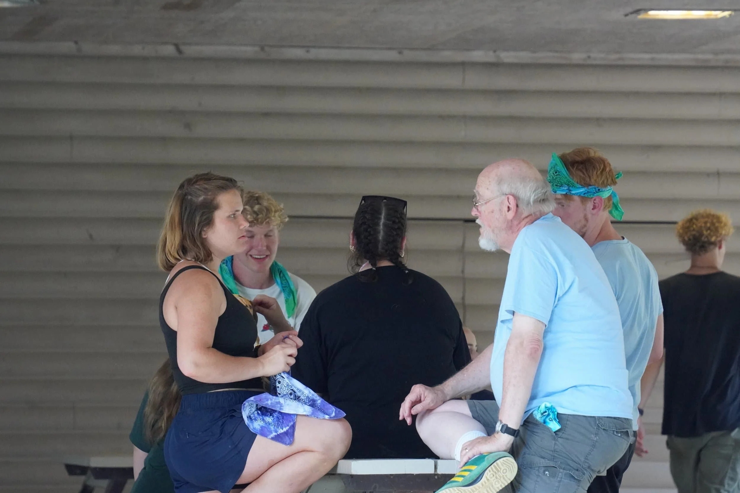 Counselor and pastor talking at snack bar.