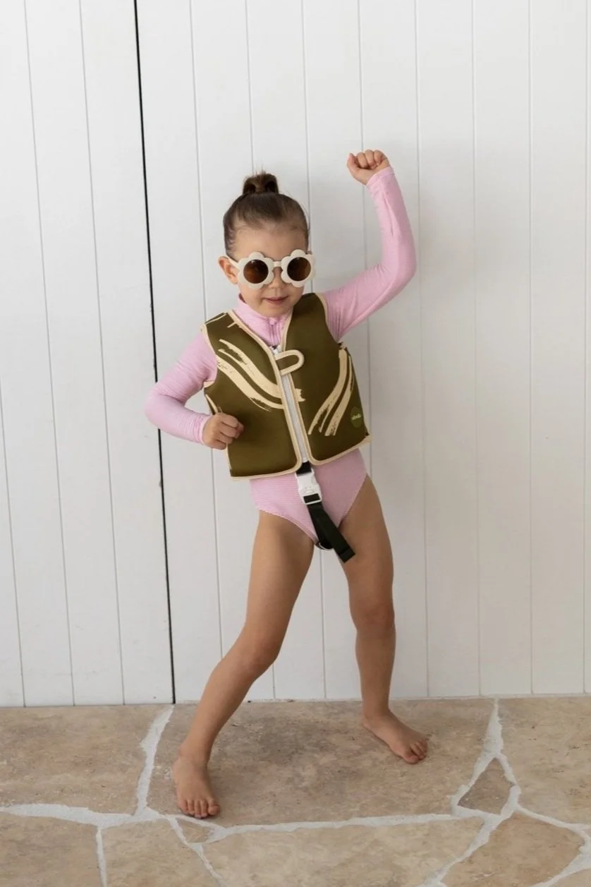 Green swimming vest for kids. learning to swim