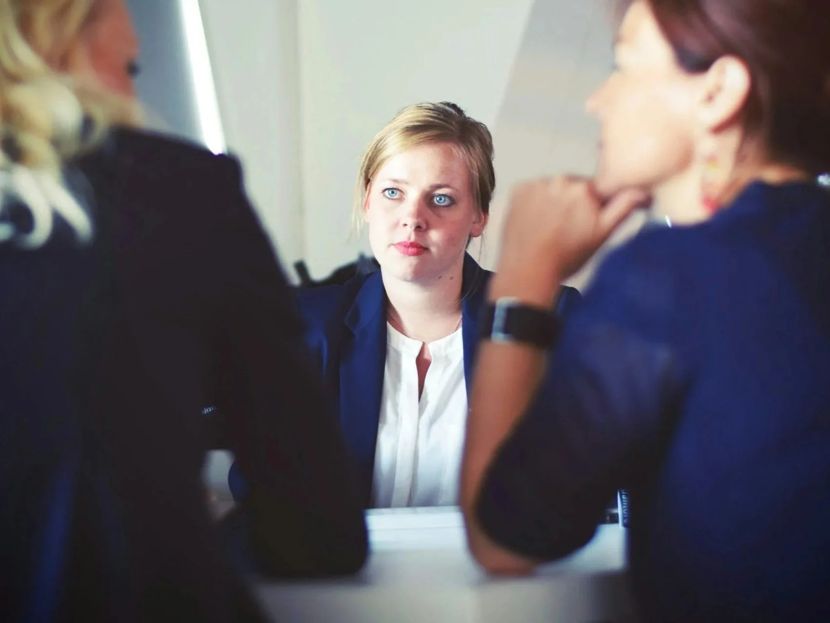 3 people in an intense conversation