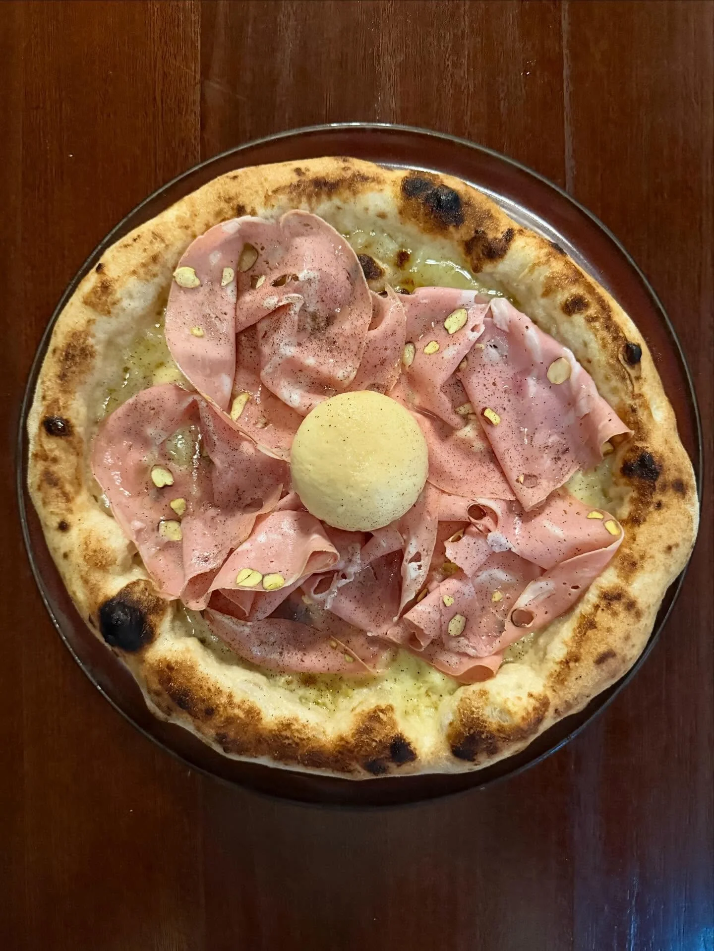 Special pizza &lsquo;AFFUMICATA&rsquo; 🍕 
- fior di latte
- onion cream
- pistachio mortadella
- smoked burrata