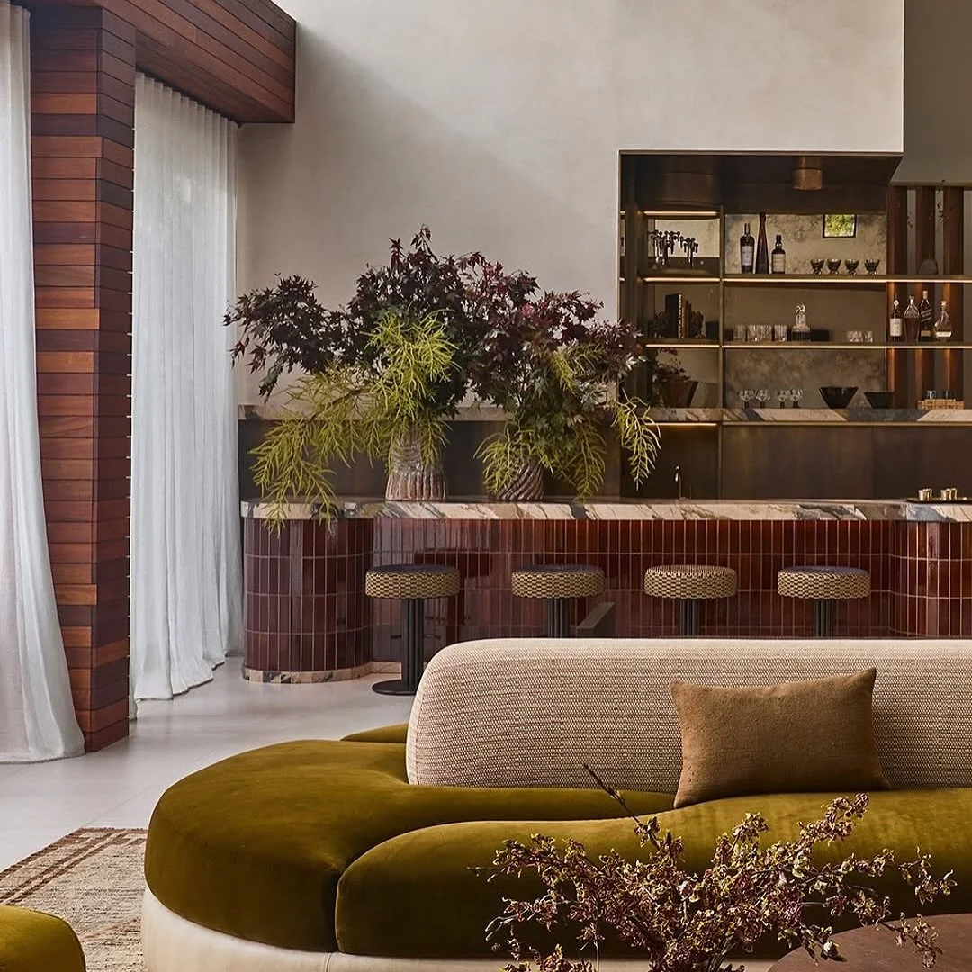 Alana Marie turned what used to be a sterile, showroom-like LA home into the kind of space where you might genuinely consider canceling your weekend plans to stay in and hang at the bar instead.
The star of the show? That sunken home bar wrapped in