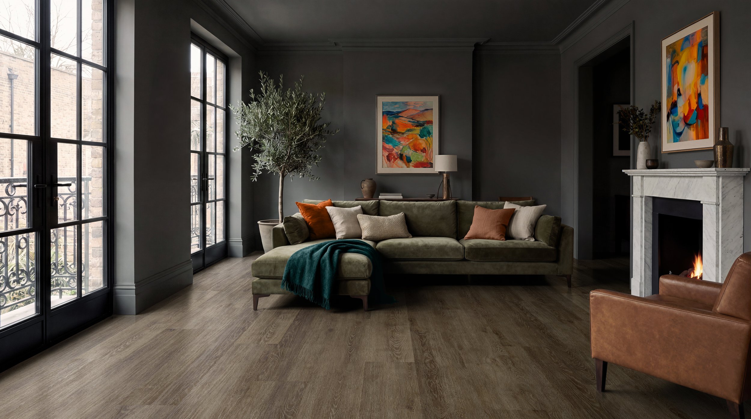 Dark brown wood-effect LVT flooring has been digitally laid into this contemporary living room to create a warm, sophisticated interior. The realistic CGI showcases rich timber tones that complement the green sofa, modern fireplace and abstract artwo