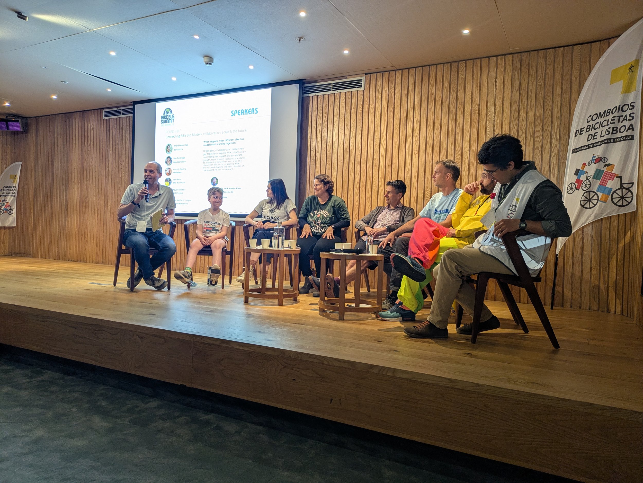 A group of people on a panel event.